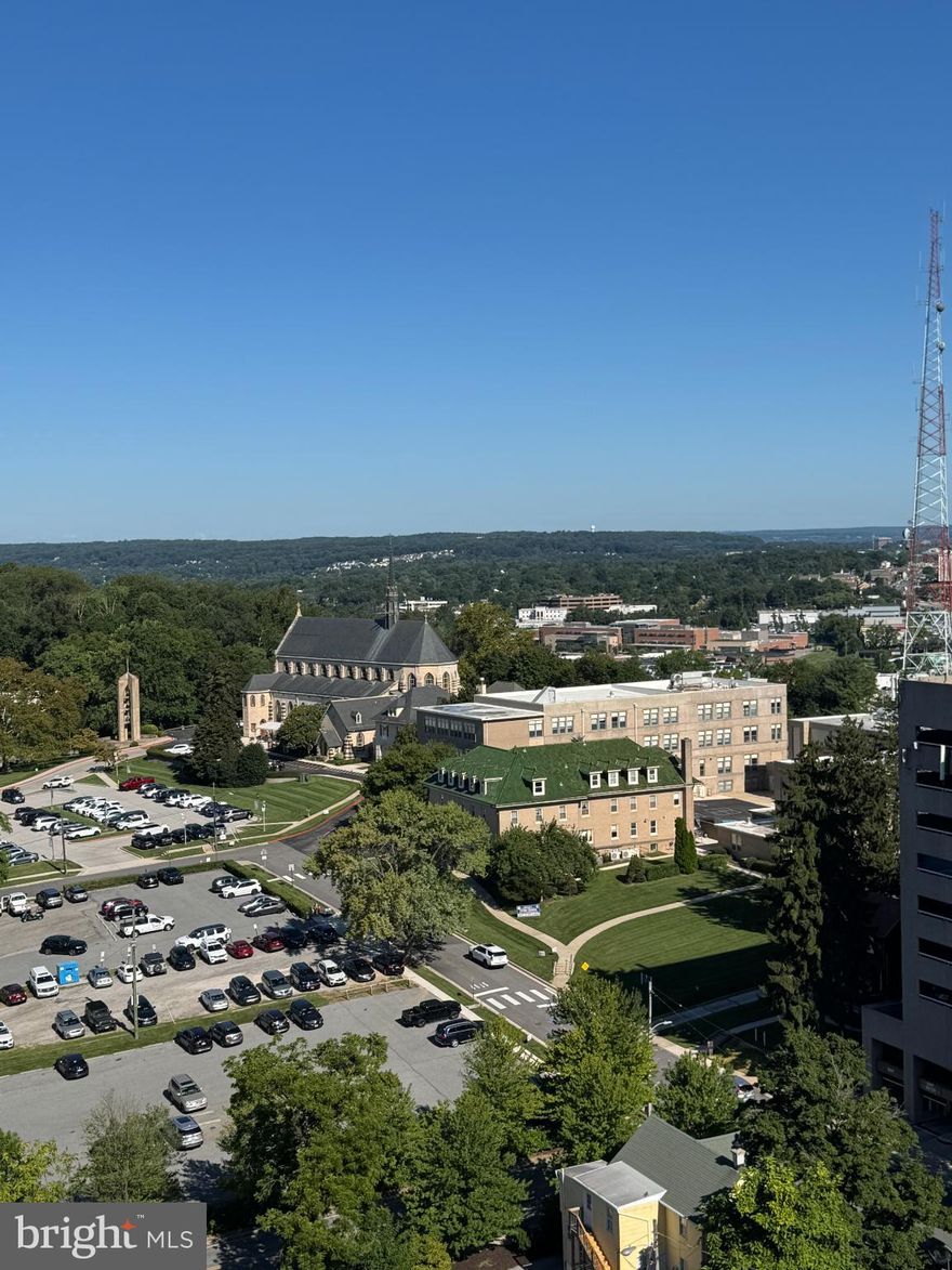 Experience urban living at THE PENTHOUSE in downtown TOWSON. This sun-soaked 1-bedroom, 1-bathroom condo boasts breath-taking panoramic views. The open-concept design seamlessly blends the dining and living areas, perfect for entertaining or relaxing after a long day. NEW LVP FLOORING in the living area and bedroom, with FRESHLY PAINTED WALLS.  Step outside to your NEWLY RENOVATED, ENCLOSED private balcony and soak in the vibrant cityscape. Water Heater. replaced 11/2025.  The building offers exceptional amenities, including a concierge service and rooftop pool, exercise room, and community room to name a few. With a prime downtown location, you're just steps away from trendy cafes, shops, churches, the movie theatre, public library, and TOWSON UNIVERSITY. This penthouse  condo is not just a home; it's a lifestyle.