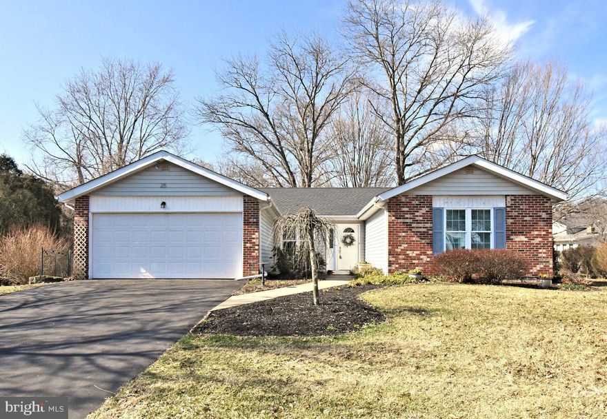 Rarely offered ranch in Newtown Crossing. Welcome to 25 South Lancaster: the classic ranch you’ve been waiting for, uniquely enhanced by a generous family room addition and a full basement. Tucked away on a quiet cul-de-sac, on a premier lot that backs to serene woods, this home offers the expansive footprint of a colonial with the seamless flow of single-level living.

Inside, the 2,000+ sq. ft. interior is anchored by a sun-drenched family room addition featuring high ceilings, bay windows, and skylights. Thoughtful pocket doors allow for a flexible layout, providing easy access to the dining room, kitchen, and living room. The design creates a comfortable separation between the main living spaces and the dedicated sleeping quarters on the opposite side of the home. The primary bedroom has been renovated for extra closets and includes an expanded ensuite bathroom with a jacuzzi tub and separate shower. Two additional bedrooms offer versatile space for children, guests, a home office, or a hobby room. While the original hall bath awaits your personal vision, the rest of the home is primed for its next chapter.

Outside, the quiet, private deck is perfect for morning coffee or a summertime cookout. Nature lovers will appreciate being a five-minute stroll from the trails of Tyler State Park, while the everyday conveniences of Newtown are just a short drive away. Practicality meets peace of mind with a two-car garage and some 2026 updates, including a brand-new roof! With a massive 1,000+ sq. ft. basement ready for your imagination, this home is a rare opportunity for downsizers, upgraders, or families looking to plant roots in the highly-regarded Council Rock School District.