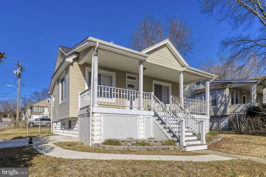 Beautifully renovated home on a corner property with off-street parking and a fully fenced yard, offering modern construction and flexible living space. The home underwent a full gut renovation in 2018, including new framing and layout, roof, siding, windows, electrical, plumbing, HVAC, kitchen, and bathrooms. The main level features a bright open-concept layout with hardwood floors, recessed lighting, and excellent natural light throughout. The U-shaped kitchen is designed for both entertaining and everyday living, showcasing tall dark wood cabinetry, granite countertops, stainless steel appliances, and a large island with an undermount sink overlooking the living and dining areas, plus a dedicated dining space. Two spacious bedrooms and a hall bathroom with dual vanities complete the main level. The fully finished lower level offers a large recreation or family room, potential third and fourth bedrooms, a full bathroom, recessed lighting, natural light, and a dedicated laundry area. Exterior highlights include a newly paved two-car-wide driveway, covered front porch, backyard patio ideal for grilling, and a level fenced yard perfect for pets or play, with additional storage beneath the front porch. Select furnishings may convey, including many items purchased in April 2024, along with stainless steel stove and refrigerator; the primary bedroom features an adjustable bed with remote-controlled head and foot elevation. Move-in ready with thoughtful updates and versatile space throughout. Home is occupied. Prior Day Notice is needed for showings.
