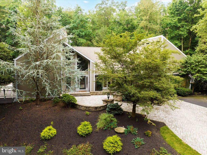 Stunning in Sinking Spring!   Enjoy this spectacular home secluded on 6.32 acres in a private estate setting.   This home has been impeccably remodeled and artfully placed to take full advantage of the amazing atmosphere.  Awe-inspiring contemporary architecture, custom inground pool, putting green, koi pond and extra large outbuildings.  Too  many amenities to describe.    Magnificent and expansive kitchen features modern appliances and upgraded custom granite countertops.   Oversized windows galore allow you to enjoy the beautiful highlights of nature while at the same time providing a sanctuary from the hustle and bustle of life.     Just imagine living life to its fullest jumping in the pool and cooking on the grill on the large covered terrace after a long day at work.   Or, relax in the steam shower.  And, no need to worry about tracking wet feet in the house since your guests can change in the cabana out-building next to the pool.     There is also a lap pool and exercise room with rubber flooring in the basement with a separate exit/entrance to the attached 3 car garage.    A whole house generator will help keep you warm in the winter if the power goes out.     The auto enthusiast will be living the dream in the 9 car garage and additional pole barn, both have high ceilings and own heating system.   These garage outbuildings are amazing!   With two primary suites, you could use one as a guest or inlaw suite.   Must see.  Home Warranty Included with acceptable Agreement of Sale.   Owner is a licensed PA Realtor.