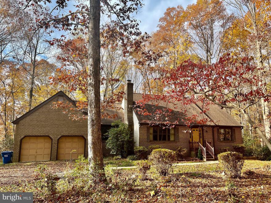 A RARE FIND- PRIVATE  SETTING , NO HOA! Original Owner, Custom Built on Almost 9 1/2 acres of wooded seclusion and privacy.  MAIN LEVEL OWNERS SUITE  with en-suite bath. 4 BR, 2.5 BA brick front Cape with oversized extra-large 2 car attached garage. Spacious Living Room with wood burning brick Fireplace. MAIN LEVEL Owner's suite with full BA plus another bedroom (smaller) located on main level. 2 large BR upstairs with a full BA. Most rooms have large windows that offer stunning wooded views. Deck and screened in porch. Private Driveway (not shared).  Unfinished BSMT with rough in ready to finish your way. Laundry hook ups on main level AND in BSMT.  Convenient location just off of Rt 4. Lots of room to play and roam plus NO HOA! Plat, floor plan and more can be found in the document section.