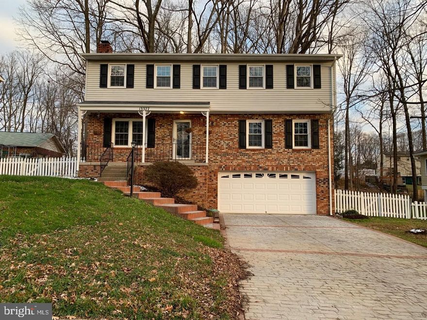 Beautiful property in a great location! This home has hardwood flooring on the entire main level, which consists of a formal living room, formal dining room,  family room and updated kitchen!  Kitchen features granite counters, stainless steel appliances, soft-close drawers, plenty of table space and is open to the family room which offers a wood burning fireplace for those cozy winter nights.   The kitchen also has a sliding glass door with built-in blinds out to the deck and private, wooded back yard.  Upstairs, you will find four bedrooms and newer carpet!  The master bedroom has a ceiling fan, walk-in closet and master bath with ceramic tile flooring and shower surround.  There are three other spacious bedrooms on the upper level  and another full bath with ceramic tile floor and shower.  The laundry room is also on the upper level for convenience.   The basement is unfinished for loads of storage and has garage access.  Property is available for occupancy immediately.  Repair deductible of $100.