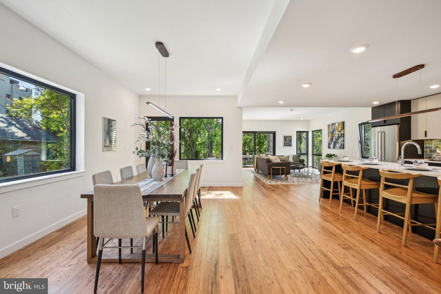 Set 40’ back from West Mt Pleasant Avenue and offering both stellar serenity and privacy, this 6-bedroom (or 5 bedroom plus office); 4.5 bath home features a huge family/great room; substantial, huge outdoor space (including decks overlooking the tree canopy and spectacular 3,000 sq/ft rear yard ); 2-car parking; huge windows for immense light; ideal layout; and a stunning, understated clean modern design.✅ This ground-up new construction is designed by the renowned C2 Architecture and developed by award-winning Bancroft Green (both local). With the Philadelphia 10-year TAX ABATEMENT, this new construction is anything but cookie-cutter. Rather it offers the tasteful high-end finishes that you would expect to see in such a brilliantly designed custom home. Spectacular, custom, light-filled spaces throughout, including high ceilings; hard eucalyptus floors; huge European windows of the highest quality (with superb energy efficiency and sound attenuation); cathedral ceilings; and exquisite, contemporary finishes. Multiple-zone ultra-efficient HVAC is complemented by the tight envelope and elevated R-factor (insulation) for premier energy efficiency. ✅ Ample outdoor space, including a walk-out wrap-around deck off the open kitchen, dining, and living area for perfectly extended indoor-outdoor living and divine entertaining. This deck and the entire rear of the home overlook the substantially oversized grassy, wooded lot that is fully removed from the city around. Hear the birds chirping and not much else. This area is one of the larger, natural outdoor spaces you will find in the city. A balcony off the primary suite also overlooks this natural lot. In the front, there is a small yard, some landscaping, and a nice patio space. The home is also set back from the street with the driveway, which offers side-by-side parking plus an easy turnaround. The front setback provides ample privacy and buffer from the street, while the heart of the home is geared towards the rear. ✅ This home offers flexible space for various needs. For example, the first floor has its own suite, with available connection to the first-floor main living space plus a separate exterior entrance—perfect for intergenerational families, a professional office, a main level primary suite, or a den/office/guest room combo. There is a spectacular 2nd floor primary suite, another full suite in the walk-out lower level (plus the family and great room), and three other bedrooms. ✅ As you look through this home with its huge European tilt-n-turn (plus casement functionality) OKNOPLAST® windows, you will not believe you are in the city. This lot offers a green and woodsy feel. Other features include the custom steel and wood stairs with floor to ceiling windows. High ceilings throughout, including pitched, 20-foot ceilings; a 2-story atrium; butler pantry; Eucalyptus floors throughout; excellent storage throughout; custom cabinetry from Studio Cidra (American modern furniture handmade in Philadelphia); and quartz countertops throughout kitchen and all baths, KitchenAid high end appliances (including wine fridge and induction cooktop), and 2-zone high efficiency Bosch heat pumps. The feel, layout, light, spaces, and finishes of this home are exquisite. ✅ Enjoy the most convenient West Mt Airy location--easily walkable to many restaurants, cafes, retail, parks, shopping, library, and more. 5-minute drive to the Wissahickon Valley and miles of wooded trails. Weavers Way Coop and Mt Airy Village. 5-minute walk to the SEPTA regional rail. And, of course, a quick ride to Chestnut Hill, Center City, Manayunk, and the Main Line. Live in one of Philly's most desirable and historic neighborhoods. Houston School Catchment (easy walk). 10-year Tax Abatement. ✅ Henry H Houston School Catchment.