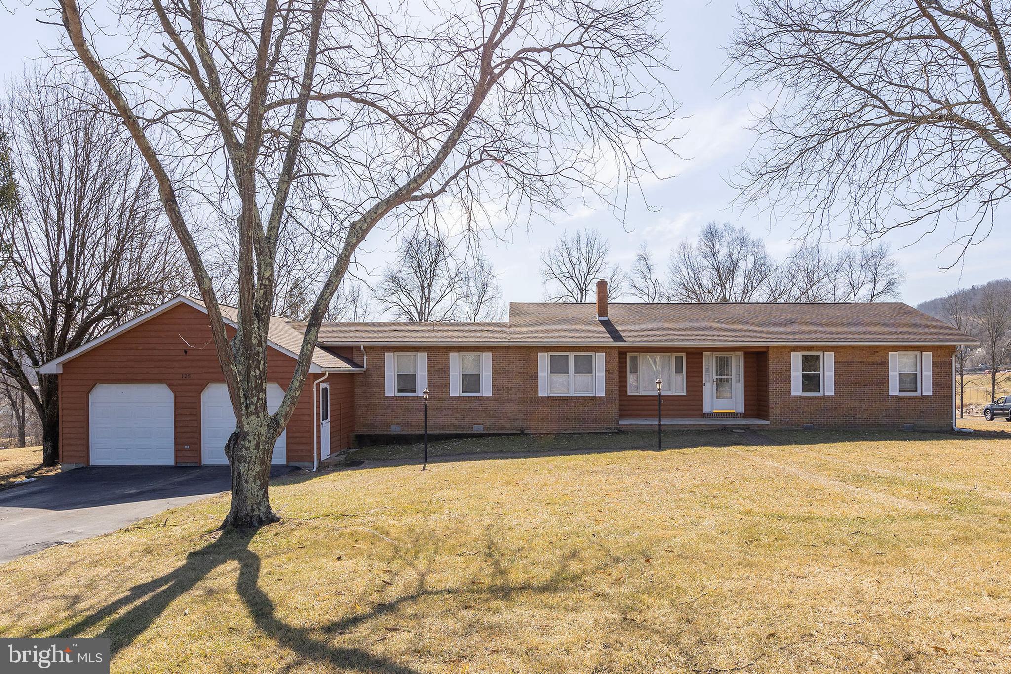 ON THE LEVEL.....SPACIOUS ONE LEVEL BRICK & CEDAR RANCHER ON GORGEOUS 1 ACRE LEVEL LOT. HARDWOOD & LAMINATE FLOORS THROUGHOUT, TONS OF NATURAL LIGHT, MASSIVE HEATED & COOLED 2 CAR ATTACHED GARAGE AND 20X16 BLOCK GARAGE IN THE BACK TO STORE YOUR LAWN EQUIPMENT & TOYS. EASY ACCESS VIA PAVED ROADS AND WITHIN SITE OF SCHOOLS, PLAYGROUND & COMMUNITY CENTER. LOCATED IN THE THRIVING VILLAGE OF CAPON BRIDGE; RESTAURANTS, STORES & ACCESS TO THE CACAPON RIVER WITHIN A 1/2 MILE....A PHENOMENAL LOCATION TO SAY THE LEAST AND ONLY 20 MINUTES WEST OF WINCHESTER, VA FOR THE COMMUTER. WHAT A PLACE TO CALL HOME AND KEEP YOUR LIFE ON THE LEVEL!