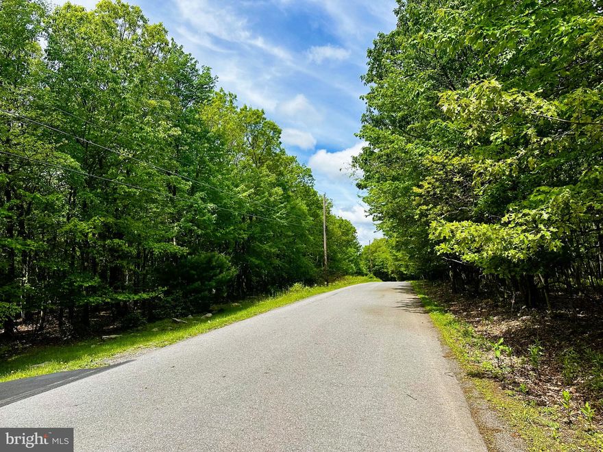 RARE OPPORTUNITY! Discover 10+ ACRES of pristine woodland atop Mauch Chunk Ridge at Bugsy’s Mountain on E. Mountain Top Rd. in Summit Hill. NO HOA & NO known restrictions—offering unmatched privacy, flexibility, and convenience.
Bordering 1300+ acres of undeveloped county/municipal-owned recreation land surrounding Mauch Chunk Lake, this property is an outdoor lover’s paradise! The wooded lot features flat to gently sloping terrain, ideal for a dream home, hunting retreat, or peaceful getaway.
The Fireline Trail runs along the ridge behind the property, granting unrestricted access to miles of hiking, biking, and exploration. Whether you seek adventure, tranquility, or investment potential, this property delivers endless possibilities.
With municipal road access & year-round maintenance, enjoy the perfect balance of seclusion & accessibility. Located minutes from downtown Jim Thorpe, offering the best outdoor and cultural experiences.
Signs posted at the lot’s entrance on E. Mountain Top Rd., with additional viewing from Fireline Trail in the rear.
Don’t miss this rare chance to own a breathtaking slice of nature in this prime location—schedule your tour TODAY!