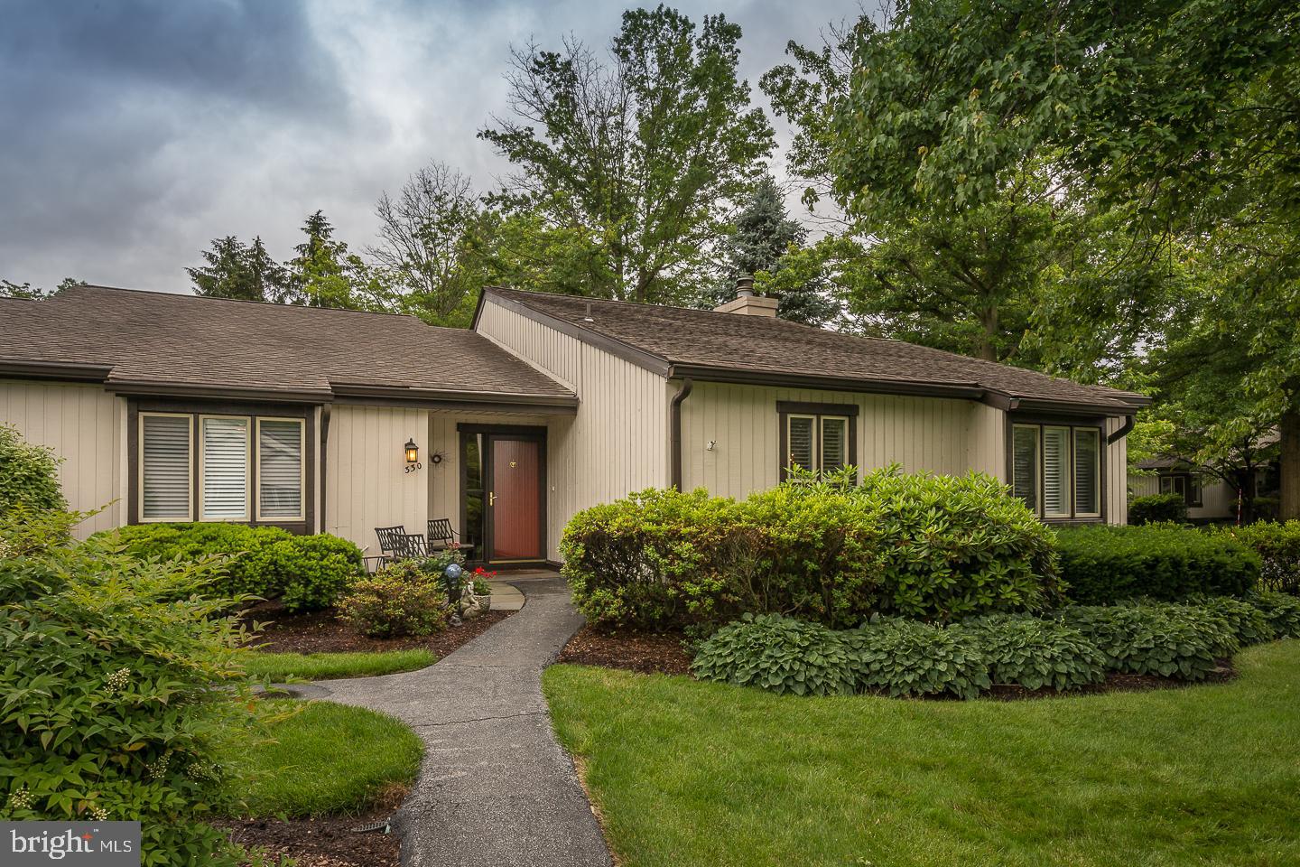 Welcome to the Marlborough model at  330 Devon Lane! Just a short walk from the carport- charming flagstone sitting area next to the front door...Enter the foyer with gleaming hardwood floors, then on the fireside living room with French doors to the family room with beamed, vaulted ceiling with built in entertainment center and exit to yard. Back to the formal dining room and very spacious updated kitchen with stainless appliances, granite, window seat and spacious pantry. Down the hall is an updated bath, laundry, two bedrooms, and master suite with double closet, walk-in closet, access to attic, built ins in the bedroom, and updated bath!  Enjoy the carefree Hershey's Mill lifestyle with all the amenities...