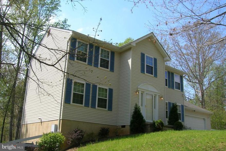 New, New, New. Fresh paint, new SS appliances, new double hung vinyl TRIPLE pane GAS filled windows installed 2012, new front door 2012,new garage door 2011, new gutters with leaf Guard system 2011, fascia and soffits encapsulated 2012, zoned heat pumps with propane gas furnace back up with auto switch over 2012, new roof shingles 2014. Enjoy the great deck and patio with fire pit. Hardwood floors