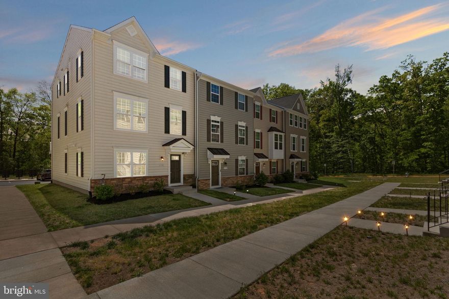 ** Seller offering $10,000 in Closing costs! ** Welcome to this NEARLY NEW  beautifully maintained  TRUE 4-bedroom END UNIT townhome backing to tree'd common space located  in the desirable Valley Run Community! With an open concept  and inviting floor plan, sleek updated modern finishes, and a fully finished lower level, this home is designed for comfort and versatility. Step inside to find a bright foyer with convenient access to the two-car garage and a lower-level  4th bedroom which can also be used as  a flex space, a home office, or entertainment room with a full bathroom. The main level boasts a spacious, open-concept layout featuring wide-plank  LVP flooring throughout, a sunlit living room, and a stylish kitchen with granite countertops, stainless steel appliances, a large island, custom pendant lighting and ample cabinetry.  Located off the kitchen is a large 20x10 composite deck over looking private open common space perfect for entertaining!   A dedicated dining area and powder room complete this level, making it ideal for both everyday living and entertaining. Upstairs, the primary suite offers a serene retreat with a  large walk-in closet and a private en-suite bath. Two additional bedrooms, a full hall bath, and a spacious laundry area provide convenience and functionality. With fresh paint, thoughtful design, and a prime location close to shopping, dining, and major commuter routes, this home is ready to welcome its next owner. Schedule your showing today!** The HOA includes ALL exterior lawn maintenance  on property and common areas, trash , recycling & snow removal. Verizon  Fios high speed available as well!