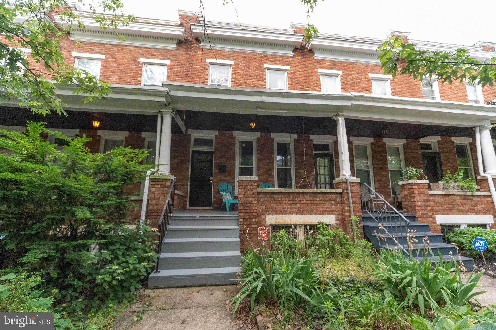 Welcome home to 313 Birkwood! A classic brick rowhome situated on a tree lined-street. This location is conveniently close to Johns Hopkins University, Waverly Market, and the library! Head up the steps to the quintessential front porch with space to chat with friends and relax on the porch swing. Enter through the foyer into a freshly painted home with beautiful hardwood floors and plenty of natural light. The front living room features a ceiling fan and two large windows. This space opens up to a large dining area with plenty of room to host family and friends! The kitchen has an island with space for meal prep, a sink, and room for bar seating. Enjoy cooking on the gas range along with a convenient second sink along the back wall. The hardwood floors carry throughout the second level of the home. Upstairs you will find three nicely sized bedrooms all with loads of natural light. The basement is perfect for all of your storage needs with an additional full bathroom! Enjoy summertime evenings on the back patio with room for a table and chairs. Schedule a tour soon before it's too late!