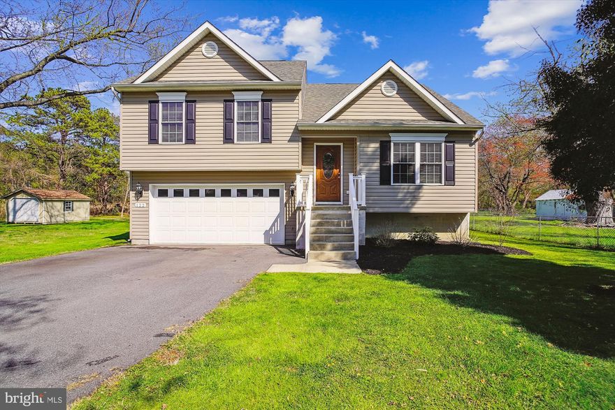 $10K Price Drop!!!! Rare Opportunity to Own this Amazing 3 BR/2.5BA SFH w/ large backyard on Kent Island. Bonus NO HOA!!! Only One Family Owned. You will fall in love with this Modern Split Foyer with a GREAT OPEN LAYOUT! Home Features Hardwood Flooring through-out the Gourmet Kitchen, Dining Area, Family Room, Hallway and even on the Steps, Cathedral Ceilings, Open Concept Kitchen, Dining and Family Room. All Bedrooms w/ Carpet on Upper Level. Primary Bedroom w/ en-suite, includes Walk-In Shower & Tile Flooring. Two additional nicely sized Bedrooms just steps away from a Hallway Full Bath w/ Tub/Shower Combo.  Gourmet Kitchen Features 42" Oak Wall Cabinets w/ turned out Crown Molding, Granite Counter Tops, Recessed Lighting, Hanging Light Fixture in Dining Area, Single Level No Drip Faucet and Double Bowl Stainless Steel Sink. Full Bathrooms Feature 12"x12" Ceramic Tile Flooring, Washerless/No Drip Faucets, Mirrored Medicine Cabinets, Oak Vanities w/ Cultured Marble Tops and Exterior Vented Exhaust Fans. Finished Lower Level Rec Room w/ Tile Floored Half Bath w/ Ceramic Tile Flooring, Pedestal Sink, access to the 2 Car Garage and Laundry Closet. Additional Home Features: 30 year Architectural Shingle Roof, Maintenance-Free Vinyl Siding, Pre-Engineered Floor Truss System for added Structural Stability & Strength, Oversized 2-Car Garage w/ Garage Open and Plenty of Storage, Private Well w/ Water Conditioning System, Public Sewer, High Efficiency Heating and Air System, Double Hung Windows w/ Tilt-out Feature, Six Panel Fiberglass Insulated Front Door w/ Doorbell, Prewired w/ 2 CAT5 Telephone Jacks and Hardwired Smoke Detectors w/ Battery Back-up.  You will really love how close you are to to jump on and off of Rt 50 and Main Street. This home is located on a Quite Street walking distance Red Apple Plaza w/ a PNC Bank, Yoga Studio, CVS, Zips Dry Cleaner, Jewelry Store, The Winery and Restaurants like Adams, Senor Chiles,  Carmine's, Shogun Sushi plus more... only minutes drive to multiple Grocery Stores, Golf Courses and the Bay Bridge.