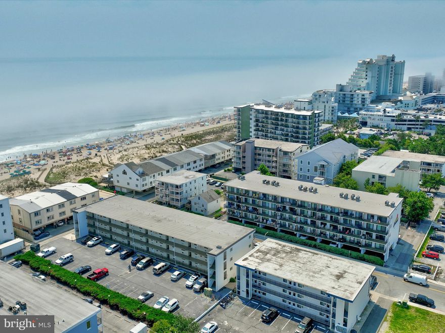 Seaplace at 36th is an amazing beach block 1 bedroom/1 bath condo with a prime location for lazy beach days and fun filled nights in OC! This easy-access first floor unit offers updated easy-care laminate flooring, white kitchen cabinets, upgraded lighting fixtures, and new furniture throughout that all stays with the unit!! The primary bedroom also offers custom built-in closet space. The private balcony offers sunny southern exposure, and this unit has beautiful composite wood outdoor furniture for your outdoor enjoyment. Well maintained masonry building keeps down on any noise from upstairs units! Well maintained and self-managed building with reasonable condo dues and reserve study in place. Private parking in the rear of building, each unit gets one space, and they are unassigned. This unit is not a rental, so easy to see, but rentals are allowed in the building. This central location is near many popular spots in town such as Coconuts/Castle beach, KCoast, Barn 34, and good proximity to the convention center or the boardwalk!
