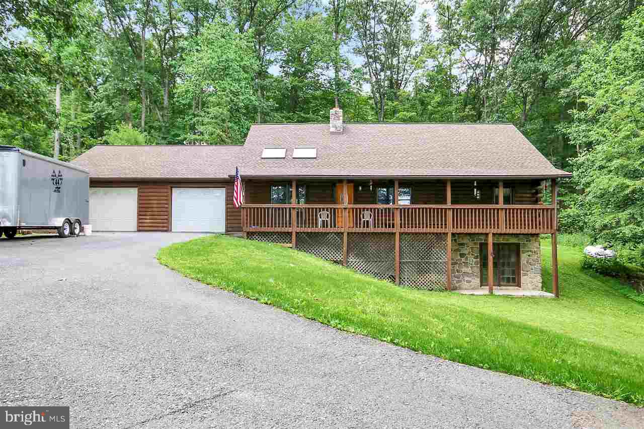 Privacy at its finest, take a look at this one of a kind Log cabin, tucked away on a back country road. The spacious log cabin boasts high vaulted ceilings with a large master. The awesome loft area is perfect for hosting a party! With over a large deck and long front porch, you can take in the views from anywhere. 15 Min from Mechanicsburg. This property is USDA approved.