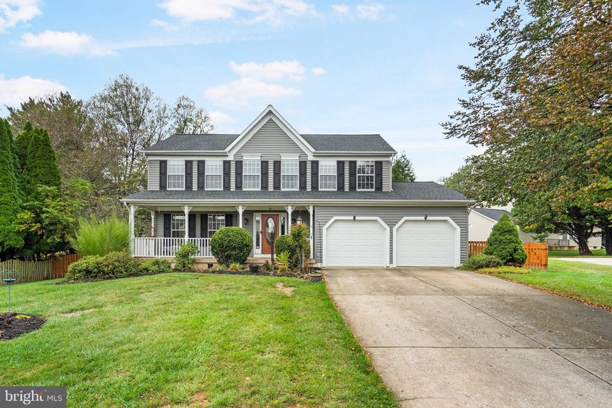 Welcome to this beautifully updated colonial featuring a charming covered front porch and spacious layout perfect for everyday living and entertaining. Step inside to find hardwood floors throughout the main level, setting the tone for warmth and elegance. The formal living room just off the foyer provides an inviting spot for guests, while the dining room offers the perfect setting to wine and dine. The fully renovated eat-in kitchen is a chef’s delight with new cabinets, quartz countertops, tile backsplash, stainless steel appliances, and a pantry for all your storage needs. An island with seating plus space for a breakfast table makes this the true heart of the home. Relax in the informal living room, a cozy retreat for movie nights, with sliding glass doors that open to the deck—ideal for hosting summer BBQs. Upstairs, the spacious primary suite is a true retreat, boasting a large walk-in closet and an updated bathroom with dual vanities, soaking tub, and a custom-tiled walk-in shower. Three additional bedrooms with generous closets, an updated full bathroom with a tub/shower combo, and a convenient laundry closet complete the upper level. The fully finished lower level expands your living space with a rec room, bedroom, full bathroom, and two storage areas. Outside, enjoy the fully fenced yard, perfect for play, pets, or entertaining. Parking is effortless with a two-car garage and a long driveway offering plenty of additional space. Conveniently located near Owings Mills Blvd, Reisterstown Road, I-795, Main Street Reisterstown, and just minutes from shops, restaurants, and more! Updates include Roof and Siding (2020), HVAC (2022).