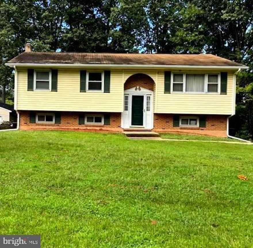 Have you ever been to visit the Elk Neck State Park, Elk Neck Forest/Walking Trails or been out on the Elk River boating and said this is a very nice area of Maryland to call home? Well now you can purchase this home that is located among all these great amenities! This large Bi-level brick and vinyl siding home is sitting on a .5 acre large lot backing to woods.  There is large finished basement family room with a wood burning stove, a 4th bedroom, full bath, wash room, replacement sliding doors and a French drain around entire basement and sump pump with back up battery. The upper level has 3 bedrooms and full bath.  Home has windows all around home and in basement to allow lots of sunlight in. The upper level living room has a very large window  and there are shutters on all the windows. There is a deck on the rear of the home, lower concrete patio and a tree lined yard that creates a calming tranquil atmosphere.  Home has high ceilings, plenty of storage areas, pull down steps leading to attic, large water heater and newer gutters with leaf covers, flower beds around home and walking distance to Elk Neck Forest and walking trails. Home is also located on a cul-de-sac with no through traffic!  There are several Marina's, boat ramps and shopping just a very short drive away.
