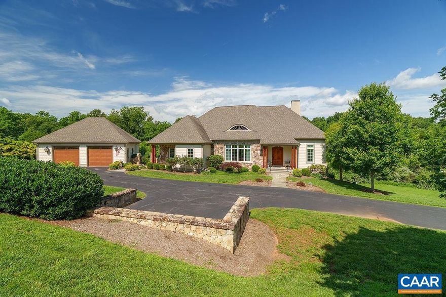 Nestled on over 3 acres in the picturesque The Rocks Neighborhood, this stunning custom home offers the perfect blend of elegance, comfort, and privacy. With over 4,000 finished square feet, this 3-bedroom, 3.5-bath residence showcases timeless architectural details and quality craftsmanship throughout. From the moment you arrive, the stone and shingle exterior, welcoming front porch, and beautifully landscaped yard set the tone. Inside, the gourmet kitchen is a chef?s dream, featuring granite countertops, stainless steel appliances, a butler?s pantry, a spacious island with gas cooktop, and a stylish range hood. The adjacent living room offers a dramatic vaulted ceiling with exposed beams and a striking stone fireplace, creating a warm and inviting space for gathering. Additional highlights include a formal dining room framed by elegant columns and archways, hardwood floors throughout, and walls of windows that bathe the home in natural light. Designed for gracious one-level living, this home also includes generously sized bedrooms, a luxurious primary suite, and a flexible layout perfect for entertaining or relaxing.,Granite Counter,Wood Cabinets,Fireplace in Den,Fireplace in Living Room