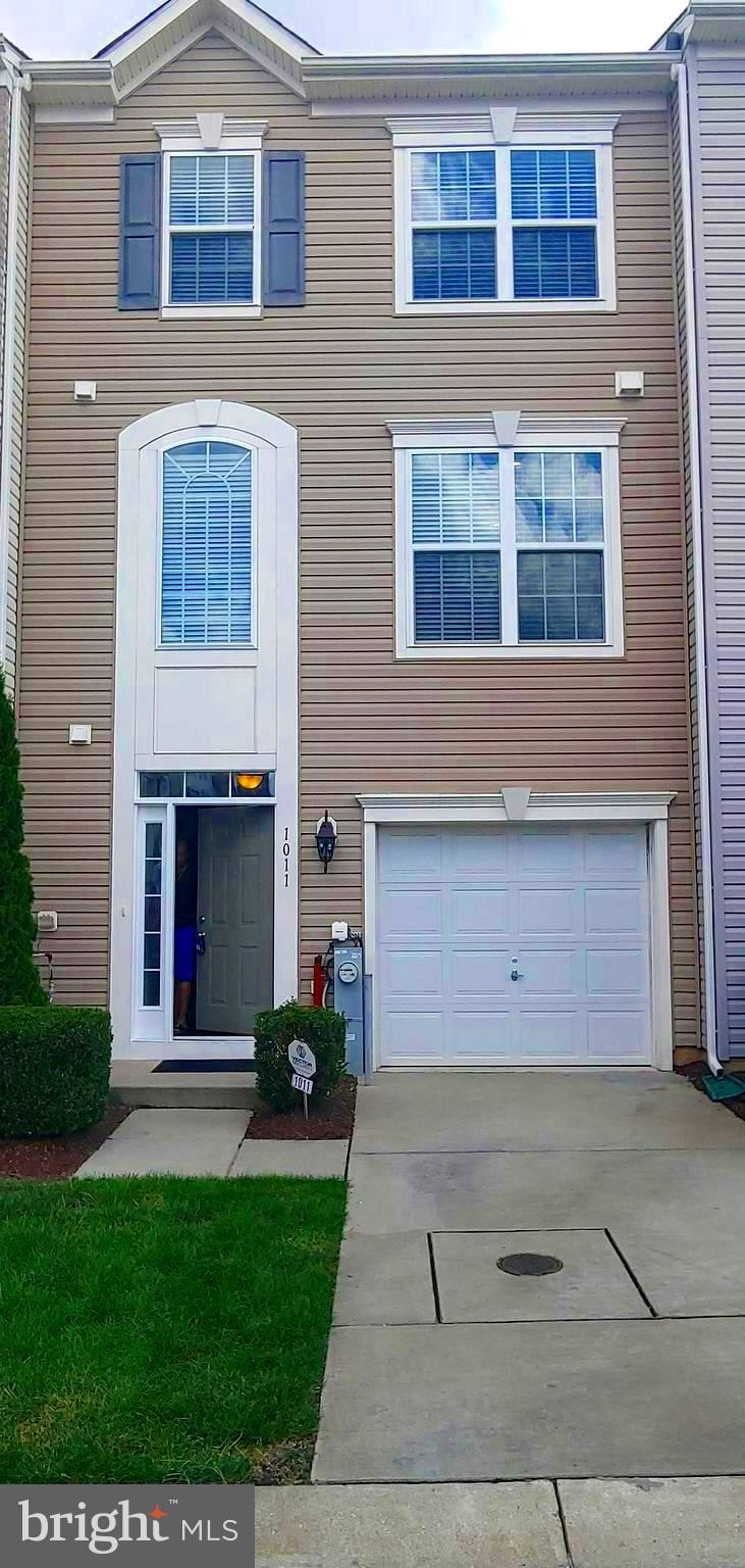 Town Home for Rent in Red Oak Crossing! Stunning Open Floor Plan! Like New, Built in 2017! Lower Level features 1 Car Garage with Wall Storage Rack System, Entry Level Half Bath, Spacious Family Room with Storage Closet, Vinyl Plank Floors, Utility Closet, Family Room that Exits to Back Yard with Trees. Main Level Features Kitchen with Plenty of Cabinets, Pantry, Stainless Appliances, Large Breakfast Island with plenty of room for Table Space, Wood Floors, Living Room is Spacious, Ceiling Fan, Exit the Slider to Luxury Vinyl Deck that comes with Outdoor Table & Chairs. Upper-Level Features Three Spacious Bedrooms, Primary Bedroom includes Ceiling Fan, Two Closets, Private Bath, Tile Shower, Double Sinks and Towel Closet. Hall Full Bath includes Tub/Shower Combo &Tile Floors. Front Bedrooms are Spacious with nice closets space. Hall Features, Hall Closet & Laundry Room with Shelves. The Upper-Level Flooring is Carpet, Tile Bath Floors and Vinyl in Laundry Room. Community is close to Shopping, 20 min to Ft Meade, 30 min to Downtown Baltimore or Annapolis, 15 min to BWI Airport. No Pets. Rental Applications Online, See Document Section for Requirements.