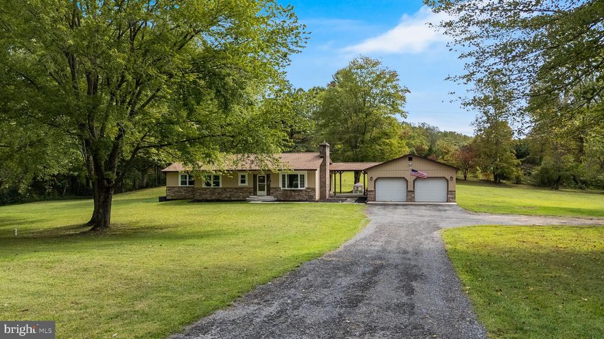 *Offer Deadline: Sunday, September 21st at 6PM* Set on 3 sprawling, usable acres with no HOA restrictions, Warren Drive offers the freedom to truly live how you want. Whether it’s boats, RVs, ATVs, or a growing car collection, there’s room for it all. Car enthusiasts will love the oversized detached 2-car garage complete with a mechanic’s pit, a dream setup for working on vehicles. An additional detached building provides even more storage, and a 50-amp RV hookup is already in place for your camper or motorhome. Inside, the home is move-in ready and beautifully updated. The main level features gorgeous hardwood floors, a modern kitchen with stainless steel appliances, and a cozy living space accented by a pellet stove with shiplap surround. Three bedrooms and two full bathrooms, all with fresh paint and stylish tile, complete this level. The owner’s suite offers a walk-in closet and plenty of room for a king-sized bed. The basement, with its tall ceilings and second fireplace, is ready to be finished into the space of your dreams, whether that’s a rec room, workshop, or guest suite. Major updates include a new septic (2023), well, roof, HVAC, and hot water heater (2014), giving peace of mind for years to come. This home gives you endless storage, room to grow, and open land in the heart of Huntingtown.