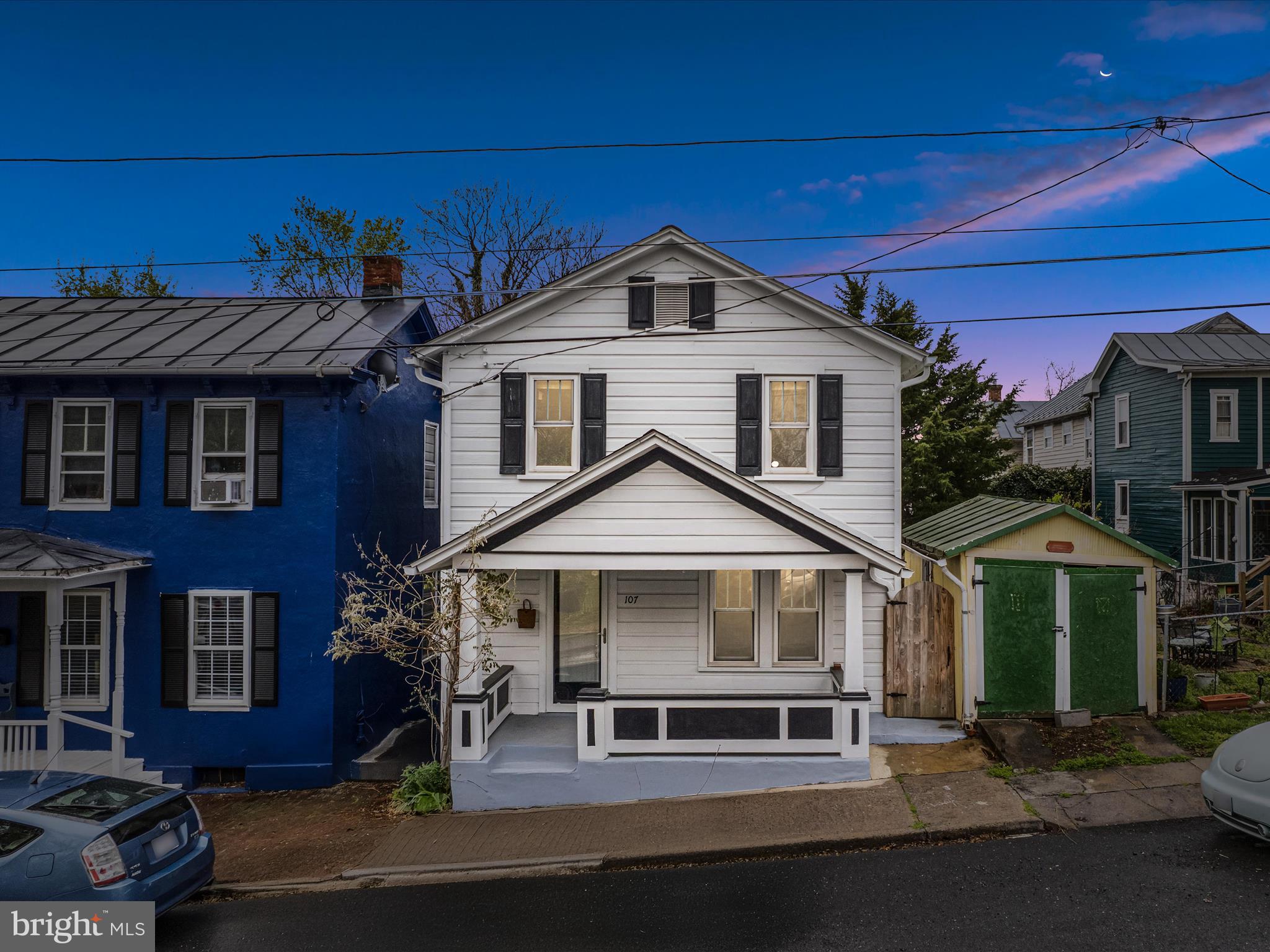Price Reduction!! Charming Historic Home in Downtown Winchester – Move-In Ready!
If you love timeless craftsmanship—think original wood floors, custom built-ins, and vintage doors—but still want the ease of modern living, this beautifully updated downtown Winchester home is calling your name!
From the moment you step onto the inviting covered porch and through the front door, you’ll feel right at home. Warm wood tones complement freshly painted crisp white walls, creating a perfect blend of cozy and fresh. The living room showcases a gorgeous staircase, beautifully refinished white oak floors, and an eye-catching wall of custom built-in shelving—ideal for your books, curated décor, or treasured keepsakes. In the dining area, you'll find even more stunning built-ins adding both style and storage.
The brand-new (2024) kitchen is a showstopper—completely renovated with quartz countertops, a farmhouse sink, stainless steel appliances, and custom cabinetry designed to impress. Step into the enclosed sun porch, flooded with natural light, or entertain guests on the spacious back deck—perfect for dining, relaxing, yoga, or sunbathing. The low-maintenance yard makes this home ideal for busy professionals or families on the go.
Upstairs features more charm and character with freshly refinished heart pine floors, two generously sized bedrooms, and a cozy third "trunk room" (no closet)—ideal as a nursery, home office, workout space, or dressing room. A full hall bath completes the upper level.
The lower level includes laundry and plenty of storage space.
Major Updates Include:
New Roof (2022)
Newly Insulated Attic (2023)
New A/C, Full Kitchen Renovation, Interior & Exterior Paint, Stainless Steel Appliances (2024)
Refinished Original Floors: White Oak (main level) & Heart Pine (upstairs)
Original doors, millwork, and hardware preserved
This home is the perfect blend of historic charm and modern convenience, all within walking distance to everything downtown Winchester has to offer.
Don’t miss your chance to own this truly special home!