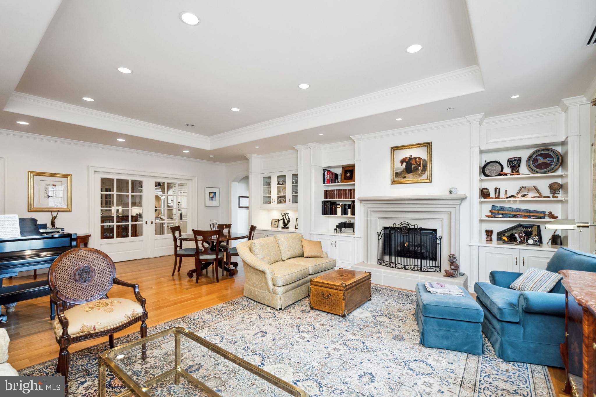 Rarely available 3-bedroom plus library and media room, 3.5-bathroom penthouse at the highly coveted Parc Rittenhouse on the east side of Rittenhouse Square. Located on the 17th floor and accessible only via fobbed elevator, this home is one of the most exclusive and private in the building. Enter the residence via secure keyless access and be greeted by the warm gallery foyer featuring inlay hardwood floors, walk-in closet that will hold all your year-round outerwear, and elegant powder room. Off the foyer to the left is the spectacular eat-in chef’s kitchen and to the right is the grand living/dining room. The kitchen boasts a huge island, porcelain double sink, beautiful cream-painted wood cabinetry, granite countertops, decorative tile backsplash, and high-end appliances including Wolf induction cooktop (gas is there if you prefer), Wolf convection double oven, Wolf microwave, Sub-Zero refrigerator and Bosch dishwasher. There’s also a wet bar with round porcelain sink, 2-zone wine refrigerator and 2-drawer beverage refrigerator. On one side, the kitchen flows into the media room with 2 TV walls, built-in cabinetry and motorized blinds. On the other side, the kitchen flows into the stunning open space of the living/dining room with its fabulous natural light from south-facing windows, ventless gas fireplace and Victor Rossi custom built-ins including China cabinet. The living/dining room may be sectioned off from the kitchen by two lovely French pocket doors that do a great job of containing sound. Continue down the extra wide gallery hallway, perfect for displaying artwork, with its arched ceilings providing a soft Tuscan feel. On the left is the library/study (which could be a 4th bedroom) with extensive floor-to-ceiling Victor Rossi custom cherry built-ins including vented electronics cabinet, lateral filing cabinets and large 2-person workstation. This room and the primary suite enjoy great north-facing city skyline views. The extremely quiet and luxurious primary suite is at the end of the hallway. It features extra sunlight from windows on 2 sides, double entry doors, inlay hardwood floors, ceiling fan, motorized blinds, 2 oversized custom walk-in closets, and 2 full bathrooms that share a Kohler digital shower system with 5 shower heads. Each bathroom has marble vanity and flooring and its own water closet housing a Toto Washlet with built-in bidet. Finally, there are 2 large ensuite guestrooms, each with excellent south-facing views, elegant bathroom, large walk-in closet and ceiling fan. One guest suite has a bathtub; the other can double as a gym due to its Victor Rossi custom built-ins that include a queen Murphy bed.
Additional highlights of this magnificent home include 10’ high coved ceilings, plentiful recessed lighting, extensive detailed molding and millwork and hardwood floors throughout; laundry room with LG side-by-side washer and dryer, sink and storage; utility room with easy-to-service HVAC units built on a vibration-reducing table; 2-zone HVAC with air cleaners, humidifiers and Nest thermostats; central vacuum system; extensive sound proofing; and a phenomenal amount of storage space including a separately keyed drop-off closet just outside the front door and dedicated space in the stair tower just outside the back door.
Available at additional cost: one owned and/or one leased parking space in the garage below the building, as well as the neighboring 1106-sq-ft 2-bedroom unit (PHD), currently rented through 3-31-24, which may be retained as an investment or combined with the larger unit.
Residents of Parc Rittenhouse enjoy world class amenities and services including 24-hour front desk staff; amenities suite with state-of-the-art fitness center, conference room and resident lounge with pantry; huge outdoor rooftop pool deck with full size pool, kids pool and hot tub; and 3 amazing restaurants on the ground floor including Stephen Starr’s Parc, Devon Seafood and Via Locusta.