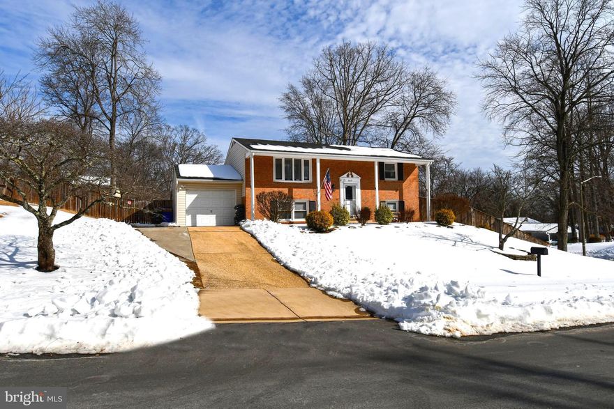 Well-maintained home in the desirable Rolling Valley neighborhood featuring beautiful hardwood floors and a tastefully enhanced kitchen with an expanded island, stainless steel appliances, attractive countertops, and a stylish backsplash. The kitchen opens to a full-length deck overlooking a professionally landscaped, fully fenced backyard with a storage shed. The primary bedroom offers a vaulted ceiling with a skylight and a private en suite bath featuring a tiled walk-in shower. The lower level includes three additional bedrooms, a full bath, and a spacious laundry room with built-in cabinetry and a new tankless water heater. A thoughtfully improved home offering comfort, functionality, and timeless appeal.