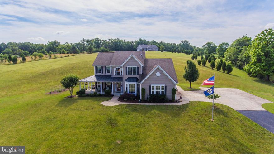 This amazing home has too many features to list. Everything you need is in this home. Custom built and one owner, very well maintained and YES you can have chickens!!! Beautiful hardwood flooring, two story foyer and family room, wonderful bedroom sizes, completely finished basement, 3 car side load garage and 5 acres of gorgeous land with vistas and privacy