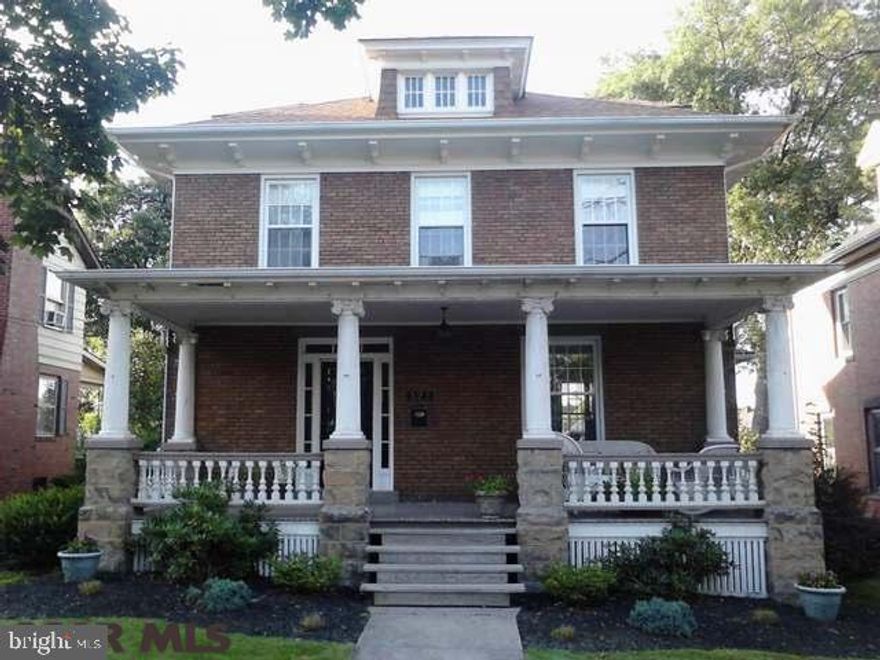 Inviting elegance and functionality meet in this beautiful forever home. Two story brick with majestic front porch. Large relaxing deck on rear with side steps walk up and fenced in back yard that leads to detached garage. Kitchen remodeled with new cabinets, granite countertops and stainless appliances in 2012. Pretty powder room and functional mud room make the kitchen space even more usable. Hardwood floors in dining room, living room and elegant foyer. Wood burning fireplace completes the first floor ambiance. Walk up the staircase and notice the stained glass window. Second floor features 3 to 4 bedrooms with 2 full baths and balcony! The bright and beautifully newly finished third floor adds more space and organization! Discover the possibilities. Schedule your private tour today!