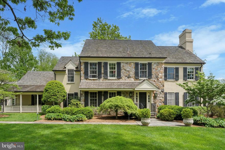 Welcome to 741 Hunt Ln – an elegant stone front farmhouse on one of the most coveted streets in Whitemarsh Township. This spectacular property is sited on just under 2 acres and features a 4 bedroom, 3 full and 1 half bathroom main house, a detached, oversized 3 car garage with a second story loft storage area, a third building currently housing a 10’ x 16’ indoor 4 ½ ft. deep endless pool with half bathroom, a new saltwater pool and recently completed pool house. Entering the main house, you are greeted by a welcoming foyer with brick floor, turned staircase, wainscoting and crown molding. Special features of this meticulously maintained and thoughtfully updated farmhouse are wide plank pine flooring, custom cabinetry and millwork throughout, deep window sills, cedar roof, copper gutters and downspouts. The elegant Living Room showcases a beamed ceiling, fireplace with custom mantle and two sets of French Doors, leading to the screened porch with brick floor, ceiling fans and views of the lovely backyard. The Dining Room, with built in cabinets and pocket doors leads to the gourmet Kitchen, which is an entertainer’s dream. A large center island, abundant storage, pantry, two Dacor ovens, warming oven, Dacor gas cooktop, two Bosch dishwashers, Sub Zero refrigerator and two sinks. An adjacent Mudroom area with sink, storage bench and outside entrance leads to a covered side porch. A wonderful Breakfast/Garden Room off the Kitchen with a wall of windows and custom storage by Village Handcrafted is perfect for hosting family gatherings with easy access to the bluestone patio with built in grill. A private Office with large box window and built in cabinetry is tucked away by the back stairs. The fabulous Family Room showcases a two story stone fireplace with raised hearth, oversized windows, custom cabinetry, board and batten wainscoting, shiplap ceiling and custom bar area with sink, glass cabinets and beverage and wine refrigerators. The Powder Room with beadboard molding and custom vanity has a hidden utility closet behind it. The second floor features an expansive Primary Suite with two custom closets with built-in dressers, a spa-like marble Bathroom with radiant heated floors, large soaking tub, stall shower with rain head and vanity area. The adjacent Laundry Room offers plenty of storage and can be accessed from the Primary Suite and hallway. Three additional, generously sized Bedrooms and two updated Bathrooms complete the second floor. The finished Basement has a large living area, sewing craft area with built-in work area and storage, game/workout area and unfinished storage room, which houses all the mechanicals. The lovely backyard oasis with specimen trees and professionally designed landscaping is now home to a new saltwater pool and pool house with outdoor living area, bar, refrigerator, stackable washer/dryer and bathroom/changing room. This exquisite property is across the lane from the Philadelphia Cricket Club’s Wissahickon golf course and steps from the Ft. Washington State Park and Green Ribbon Walking Trails. Conveniently located near schools, shopping and restaurants of Flourtown and Chestnut Hill and minutes from Rt. 309 and the PA Turnpike with easy access to Center City.  One Year Home Warranty