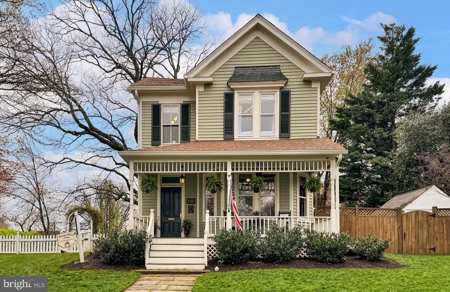 🏡Welcome home to 322 E Broad St! • Prepare to be enchanted by this stunning 4 bedroom, 2 bathroom 1890's Queen Anne Style Victorian Farmhouse, lovingly known as the "Brunner-Kellogg House" • From the moment you approach, the slate stone walkway and expansive full-sized front porch beckon you to linger, perhaps with a refreshing glass of lemonade on a warm summer's day • Upon entering through the stained glass transom doorway, you're transported back in time while marveling at the meticulous restoration that has brought this home back to its original splendor • Original maple floors grace the entire home, complemented by 9-foot ceilings, restored period light fixtures, and exquisite handcrafted millwork • Step into the living room and be captivated by the wood-burning fireplace and the original bay window adorned with antique wavy glass, creating a cozy and inviting atmosphere • Entertaining is a delight with archways leading to the formal dining room, featuring a faux fireplace with an antique cast iron insert and turn-of-the-century tilework • Continue to the fully renovated gourmet kitchen, where modern amenities blend seamlessly with timeless charm • From the granite countertops to the high-end stainless steel appliances and era-styled cabinetry, this kitchen is a chef's dream • Adjacent to the kitchen, the charming breakfast nook offers access to a spacious flagstone patio and lush green yard, perfect for outdoor gatherings • The main level boasts a picturesque bedroom complete with a renovated ensuite bathroom featuring farmhouse sliding doors, adding both convenience and charm • Ascend the majestic staircase to the upper level, where handcrafted millwork, a lovely newel post, and a 9-foot built-in bookcase await • Three generously sized bedrooms and a renovated full bathroom provide ample space for family and guests • Descend to the lower level, where a once barren cellar has been transformed into a vibrant, well-lit bonus room with wainscoting walls and fresh new carpet, offering additional living space for relaxation or recreation • With a large driveway accommodating up to six cars, parking is never an issue • Nestled in the heart of Falls Church City, this storybook house is within walking distance of vibrant downtown amenities, including grocery stores, restaurants, independent shops, and coffee shops • Conveniently located near major commuter routes and the East Falls Church Metrorail, 322 E Broad St invites you to love where you live! • Recent Upgrades Include: Roof w/Architectural Shingles • Oversized Gutters w/Round Downspouts • Cafe Appliances • Entire Home (Interior & Exterior) Freshly Painted w/Premium Paint • Front Porch Floor • Duct Work & Plenum Replacement • Floor Joists Reinforced • Washer Dryer (Upper Level) • Main Water Line • Windows & Carpet in Basement • Attic Insulation & Fan • Main Level Hardwood Floors Refinished • Yard Sprinkler System • Asphalt Driveway, and more!