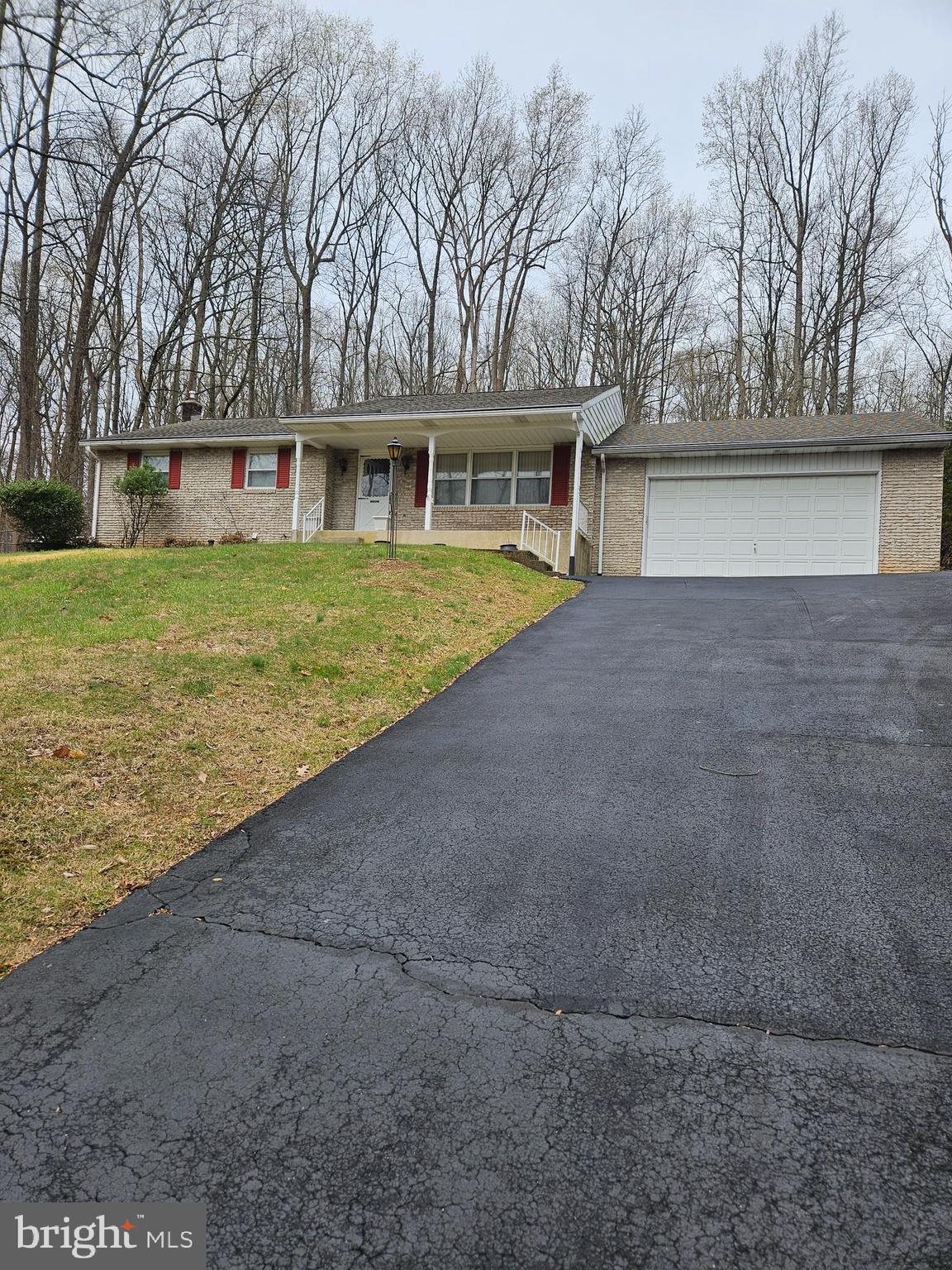 Quality built Ken Moyer brick ranch house in New Hanover Township. Located on 1.1 acres, the main floor includes a spacious living room with a beautiful picture window. The dining area is adjacent to the kitchen that features an island, double ceramic sink, wood cabinets and laminate floor. Main bedroom includes a powder room. There are 2 more nice size bedrooms with closets and a full bath that completes the main floor. The lower level features an office/family room with a propane heater and plenty of shelving. There is a workshop area with workbenches plus work tables and a large laundry area with shelves. There are 3 sheds on the property along with a partial fenced rear yard. Another feature is a whole house generator. All room sizes are estimates. Schedule your showing today!
