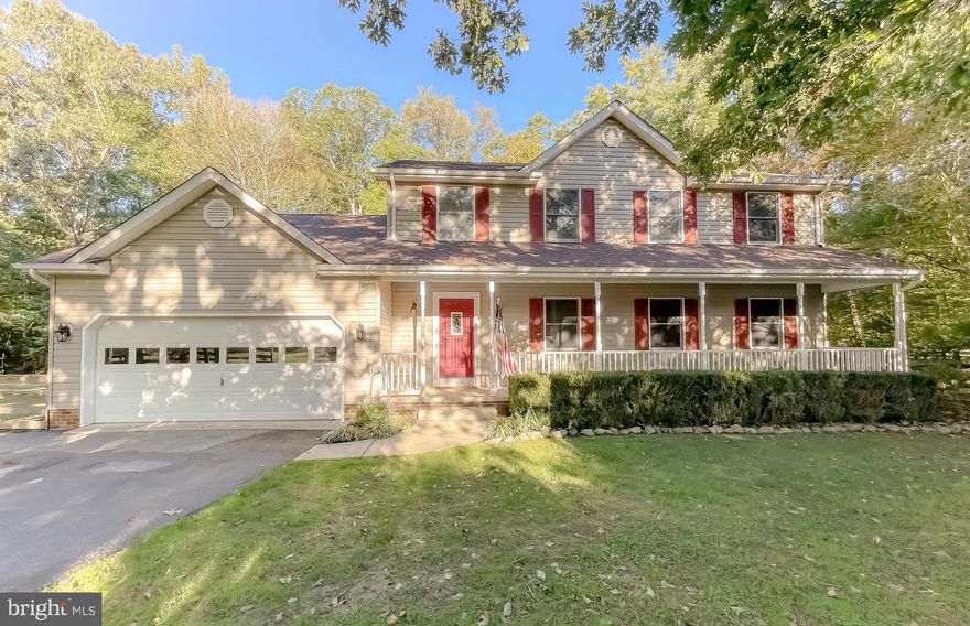 Gorgeous Colonial on a Beautiful Corner Lot on over Two Acres in sought after Cox’s Run. Well-Maintained Home with an Open Floorplan and Hardwood Floors throughout Main Level. Large Family Room with Vaulted Ceiling and a Cozy Wood Burning Fireplace. Bright Kitchen with Tons of Workspace, Stainless Appliances, Granite Countertops, Breakfast Bar Seating and Lots of Storage. Large Living Room and Formal Dining Room for Entertaining.  Enchanting Primary Suite with a Walk-In Closet and Ensuite Bathroom with Double Vanity, Oversized Two Person Shower and Tons of Storage.  French Doors lead to a Huge Screened-In Porch with a Brand-New Wrap-Around Deck that overlook the Private Backyard Backing to Trees.  Two Sheds, Two Car Garage and Tons of Parking Space. Lovely Covered Front Porch will welcome you Home. Brand New Roof!  Charming.