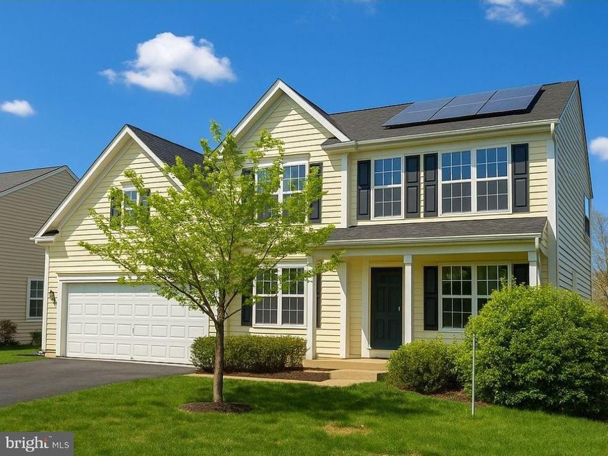 Remarkable, three finished level colonial offers a premium setting with a screened deck & custom patio overlooking the fenced backyard & wooded common area! Freshly painted and new hardwood style luxury plank flooring make this home move-in ready!  Gourmet kitchen w/ extended center island, stainless steel appliances, granite countertops & breakfast counter passthrough to the sun room - Primary suite w/ dual walk-in closet, luxury bath & sitting room - Spacious secondary bedrooms - Full finished basement with level walkout to the patio & back yard - Lower level offers a recreation room, media/exercise room. fifth bedroom, full bathroom, den and wet bar/kitchenette.... perfect au-pair suite!  Incredible savings with seller owned, $40K solar panel system!  Fantastic community amenities & minutes to Virginia Rail!