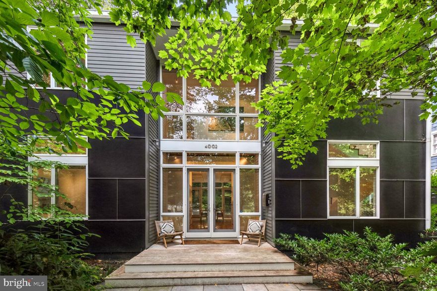 Welcome to 4002 Thornapple Street, a masterful creation by the distinguished architect Mark McInturff, completed in 2008. This exquisite contemporary residence offers a private sanctuary that effortlessly combines refined luxury with the tranquil allure of its wooded setting, all within the prestigious enclave of the Town of Chevy Chase. Encompassing over 5,000 square feet of sophisticated living space, this home is gracefully situated on a secluded 7,200-square-foot lot, epitomizing both elegance and practicality. The Garden Design is by Oehme Van Sweden, a renowned Landscape Architect.

As you enter, you are welcomed by an impeccably designed main level featuring a stately office, a chic powder room, and an expansive family room. The culinary space is a testament to modern luxury, showcasing a sleek kitchen outfitted with premium stainless steel appliances. The seamless transition to the outdoor patio reveals a contemporary water feature, creating an enchanting backdrop for both entertaining and repose. The patio is complemented by two distinct structures: a refined screened-in room ideal for serene moments and a versatile storage shed.

The upper level is devoted to personal comfort, presenting a sumptuous primary suite with a generous size balcony and a spa-inspired bathroom. Revel in the opulence of the deep soaking tub and the indulgent shower, equipped with multiple shower heads for a truly rejuvenating experience. This level also includes two elegantly appointed bedrooms, another balcony, a stylish full bath, and a convenient laundry area.

The fourth level is an exclusive retreat, featuring a private bedroom suite with a gracious sitting room and an elegant full bath—perfect for out of town guests or an Au Pair. The lower level offers an impressively expansive space, complete with a full bath, there is the the potential for a fifth bedroom, providing versatility to suit any need.

4002 Thornapple Street is the epitome of high-end living, where architectural brilliance meets luxurious comfort, creating an unparalleled residence for those who seek the very best.