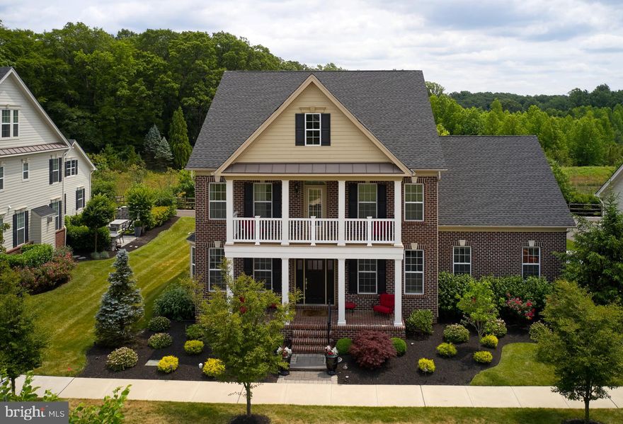 This Exquisite Former Model home in sought after Fenton's Corner has every upgrade and amenity the most discerning Buyer can want in a luxury home. This home features  impeccable design, high-end finishes, extensive upgrades, and prime location making it an ideal haven for those seeking an upscale lifestyle. 
Stepping up to the gorgeous brick front home and walking through the front door, you are greeted by a grand foyer with hard wood floors, extensive woodwork, high ceilings and a sweeping staircase. The elegant entryway sets the tone for the rest of this remarkable home. The open concept living area is flooded with natural light, creating an inviting space for both relaxation and entertaining. The Formal Living room is stunning with all the moldings and detail. The Formal Dining room offers more millwork from floor to ceiling. The heart of the home is the gourmet kitchen, which is sure to delight any culinary enthusiast. It showcases high-end stainless steel range, double ovens, granite countertops, a center island with a breakfast bar, abundant storage space, and a stylish backsplash.
Cozy up in the family room, complete with a gas fireplace, offering warmth and comfort on cooler evenings. Need a quiet space to work or study? The private study/home office with gorgeous brick walls is the perfect retreat. Escape to the luxurious Owners' suite, where tranquility awaits. The spacious bedroom offers a peaceful sanctuary, complemented by scenic views through large windows. Pamper yourself in the primary bathroom, featuring a sumptuous soaking tub, a walk-in shower, and dual vanities. A large double walk-in closet provides ample storage space for your wardrobe and accessories. Additional well-appointed bedrooms and bathrooms ensure that family members and guests feel right at home. The thoughtful layout of this residence caters to both privacy and togetherness. There is a bonus room with its own back staircase that can be used as an extra family room. office or workout room.  Finished lower level with a full bath is additional living space for entertaining. There is a Full bar for entertaining. 
Outside, an oasis awaits.  A Covered porch with stone gas fireplace is the perfect place for morning coffee or watching a game on a fall afternoon. The stone waterfall and Full built in outdoor kitchen with dining area take outdoor entertaining to a new level. Professionally landscaped backyard is perfect for outdoor  gatherings. 
Convenience is at your fingertips with local amenities, shopping centers, and dining options just moments away. Parks, schools, and recreational facilities are within a short distance. Commuters will appreciate the easy access to major highways and transportation options. Located close to Doylestown, Peddlers Village and New Hope! Don't miss the opportunity to own this exquisite property in Buckingham, PA. Schedule a private viewing today and imagine yourself living a life of luxury and comfort at 4850 E Blossom Drive