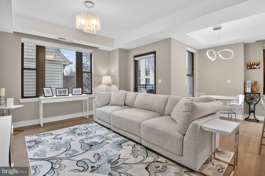 Stunning 2-bedroom, 2-full bath corner unit condo featuring abundant natural light. This home includes spacious living room with exit to a private balcony, gourmet kitchen with stainless steel Bosch appliances including gas cooktop, quartz countertops, and a center island that adjoins dining area. The main bedroom suite includes a full bath with ceramic tile walk-in shower.  There is also a spacious  second bedroom and an additional full bath in the hall. Two garage parking spaces (P3-21, P3-22) convey.  Washer & dryer in unit.  Custom window treatments. New hot water heater (2026).  Be sure to view the building amenities, which include a fitness center on the 2nd floor, large rooftop outdoor spaces on the 9th and 10th floors, and a common area party room with a kitchenette on the 9th floor.  Conveniently located in downtown Bethesda, the condo is near the Bethesda Metro, future Purple Line station, Marriott Headquarters, NIH, Walter Reed, buses, restaurants, shops, and more.  Pets ok with restrictions.  A real beauty!