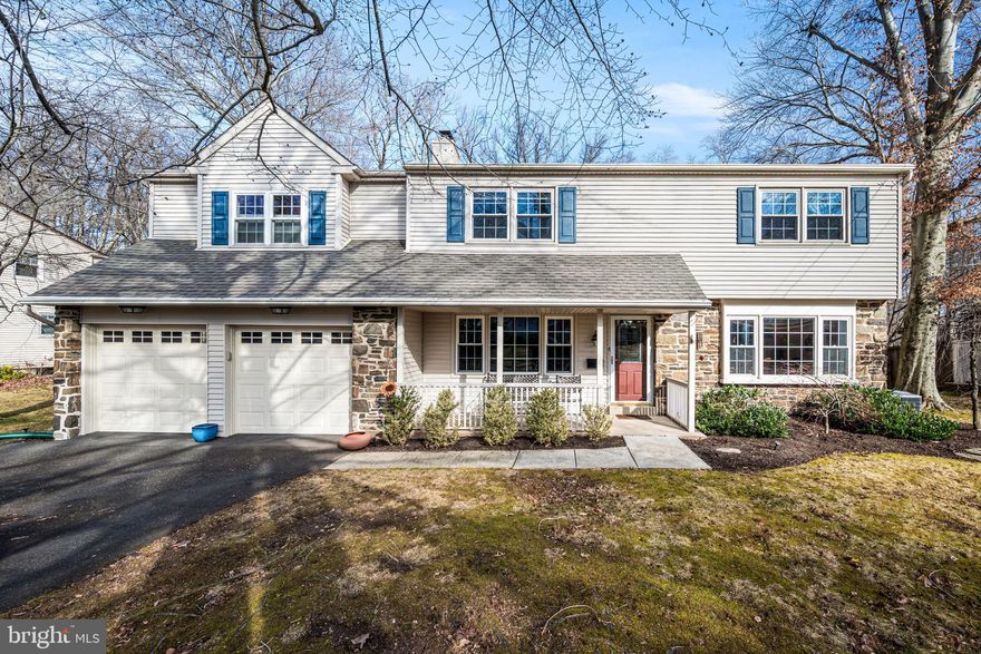 Welcome to the community of Aidenn Lair! Enter through the Italian-tiled center hall of this lovely expanded two-story colonial. The living room to the left and the dining room to the right are replete with hardwood floors, while recessed lighting can be found throughout the first floor. A gas fireplace and ceiling beams make the living room a cozy space for everyday living or hosting guests. A beautiful picture window fills the inviting dining room with natural light. Step into the eat-in kitchen with floor to ceiling cabinetry, tiled backsplash, granite countertops, and a spacious pantry. The kitchen opens to the den featuring another large picture window overlooking the fenced-in yard with a patio space perfect for outdoor entertaining. The den also has access to the first floor powder room and laundry room with abundant built-in cabinetry. Just past the den is a sizable office with room for two work spaces and an exit to the two-car garage. The second floor hosts five bedrooms and three full bathrooms. The beautiful sun-filled primary bedroom contains oversized windows pouring in light with unobstructed views of scenic Aidenn Lair Woods. The primary bathroom is your own oasis with double vanity quartz countertop, heated jetted tub, and expansive walk-in glass shower. Two closets complete this primary suite. The second bedroom enjoys its own en suite bathroom with shower. The three other nicely sized bedrooms all have great closet space and share a hall bathroom with cultured marble countertops and bathtub. Head down to the finished, carpeted lower level, which provides exceptional versatility. It currently serves three functions including a gym area, play area, and craft area, and still contains ample storage for utilities, etc. This property backs up to Aidenn Lair Woods, with Aidenn Lair Park up the street, Jarrettown Elementary School within walking distance, and minutes to George's Market in Dreshertown Plaza, plus easy access to major highways including I-276 and Route 309.  Schedule your private showing today to experience the space, setting, and comfort of this well-rounded home.