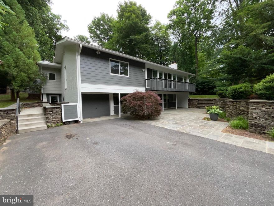 Beautifully updated and expanded, this sensational single-family home in the Carderock Springs Subdivision blends the unique original floor plan with a modern architecture with updated technology and design. Home features a chef's kitchen with 6 burner gas range, an elevated kitchen roof to accommodate extra cabinet space, Silestone countertops and a large kitchen island that opens to the dining area. The spacious living room features a wood burning fireplace, newly installed recessed lighting, hardwood floors and abundant natural light. The huge primary suite has vaulted ceilings, custom walk-in closets and private access to the rear patio. The spa-like primary bath has a soaking tub, 2-person steam shower and heated floors. Two more bedrooms with custom closets and another full bath with spa shower and heated floors complete the upper level. Entry level features a spacious guest suite with private, exterior entrance and a luxury bath. A lower-level family room with wood burning fireplace, an office and a laundry room complete the entry level. The backyard has been designed for entertaining with an expansive stone patio, water feature, planters, retaining walls and exterior illumination. Awesome quiet neighborhood, close to shopping, I/495, VA border.