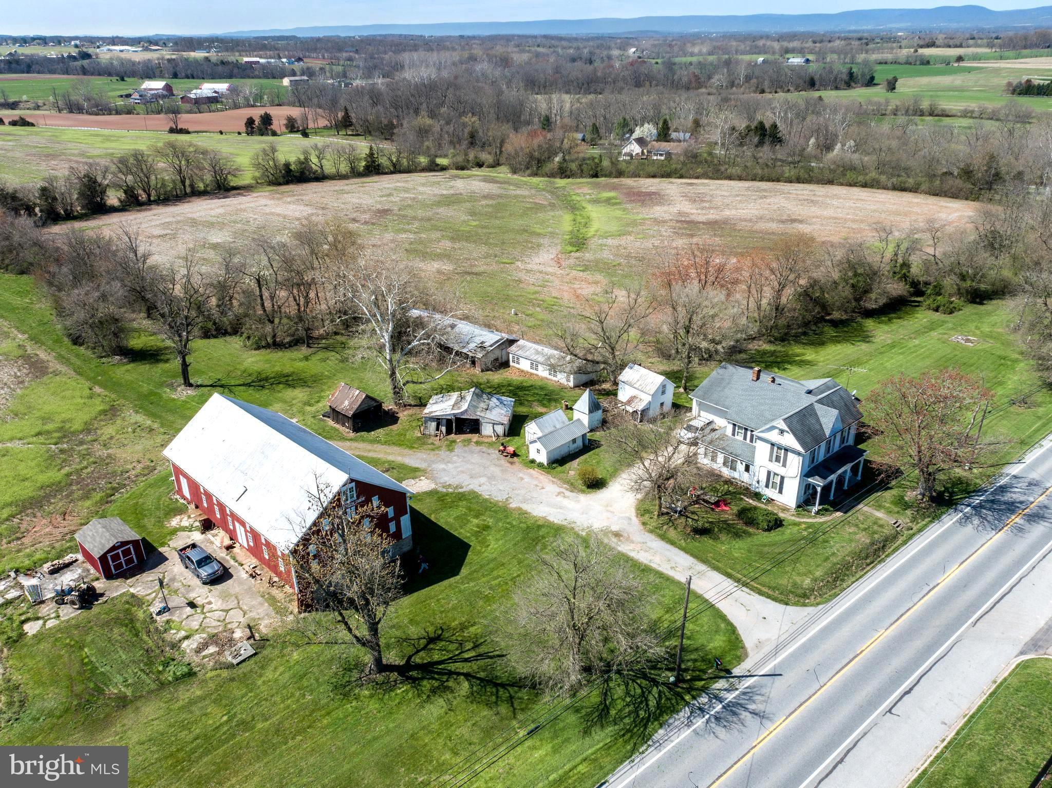 Fantastic opportunity to own 63 +/- acres just outside of Taneytown city limits. Zone AG. Currently not in land preservation. Multiple outbuildings and run in sheds. Oversized barn is in good working order, with 2/3 ground level stalls, main level for hay/straw, machinery, grain room and storage. The farm house consist of 5 bedrooms and 2 full baths. Main level bedroom and laundry. Large 2 car garage with unfinished basement and sub basement. Due to the property layout listing agent must accompany all showings. Home is currently tenant occupied and must have 24 hr notice to view the home. The exterior and land does not need advanced notice..