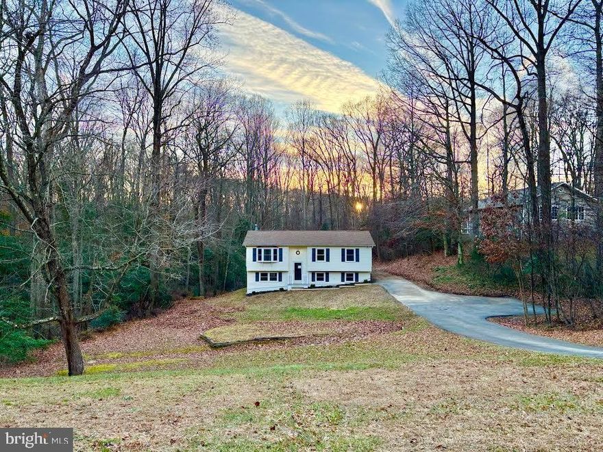 Professional photos to come soon!

Nestled near the back of the desirable Country Lakes community, this completely remodeled split foyer home offers a harmonious blend of privacy and comfort. Step inside to discover a bright and open floor plan of the living room, dining room and kitchen areas. The kitchen features upgraded 36" white Shaker soft-close cabinets, quartz countertops, an island with seating space, and stainless-steel appliances, perfect for culinary enthusiasts. The dining room provides access to a back deck, perfect for outdoor dining. Down the hallway, the first three bedrooms boast plush new carpet and modern ceiling fans, equipped with remote controls. The primary bathroom exhumes luxury with the custom tiled walk-in shower, 30" vanity and modern matte black fixtures. Enjoy cozy evenings by the Wi-Fi capable electric fireplace in the lower-level family room, also with plush new carpet. The fully finished basement features the additional two bedrooms and a full bathroom, and has a separate outside access to the backyard.