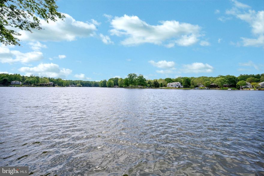 Imagine wonderful sunsets from the perfect lake home or dock, designed by you and built for you!  Whether you enjoy your day on the boat, kayak,  jet ski, simply swimming or floating from your dock, or entertaining family and friends, this lot provides the ideal setting for your dream home. So let's get this lake home and lake life started! Situated on the main lake boasting 80 feet of water frontage, you'll love the lifestyle! As an added bonus, water and sewer and electric are present.  A private, gated, secured community, Lake of the Woods offers anything and everything you could possibly want. Home to two lakes (the 550 acre main lake and a 35 acre "fishing lake"), a golf course, an equestrian center, a fire and rescue department, and a church all within the gates, Lake of the Woods simply has it all. Whether your passion is boating, water skiing, kayaking, golfing, horseback riding, or simply taking in the breathtaking views from the clubhouse while enjoying a fabulous meal, from your own deck or yard, or from one of the beaches, you won't be disappointed! Perhaps you'd like a game of bridge or volunteering your time and talents...Lake of the Woods offers more than 60 clubs and/or organizations from which you may choose to become involved. Located in Orange County, we are fortunate to enjoy low real estate taxes. Coupled with home prices ranging from the mid-$100,000s to over $2,000,000, Lake of the Woods is the perfect community for both full-time residents, as well as weekenders. But don't take my word for it, please come see for yourself! I will gladly give you a tour of Lake of the Woods by boat and by car so that you may experience why I love Lake of the Woods!