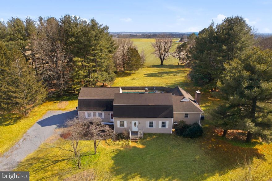 This stunning 4-bedroom, 2.5-bath Colonial home is a perfect blend of serene country living and modern convenience. Nestled on a large corner lot, it offers breathtaking mountain views while keeping you close to everything Frederick has to offer.

The primary suite is a true retreat, featuring a cozy fireplace, luxurious private bath, and spacious walk-in closets. Hardwood floors throughout the home, adding warmth and character. The private backyard is made for entertaining, complete with a patio and sparkling pool—ideal for hosting family and friends or simply unwinding in style.

With expansive off-street parking attached 2 car garage, Bonus suite above the garage and a layout designed for both comfort and functionality, this home has it all. Don’t miss out on the opportunity to make it yours!