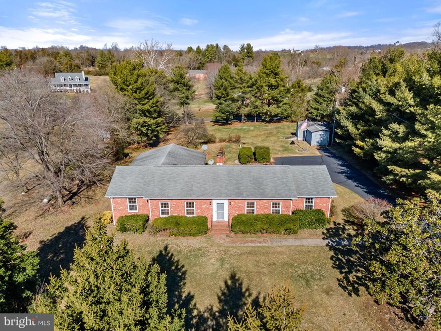 Welcome to your dream home! This solid all-brick one-level residence, built with meticulous care in 1972, offers the perfect blend of timeless elegance and modern convenience. Boasting three spacious bedrooms, three full baths, and an additional office with glass French doors for working from home. With 2,473 square feet of living space, including a family room adorned with built-ins and a cozy gas fireplace, comfort and style await at every turn. Step outside to the expansive 20x10 deck, ideal for entertaining or simply enjoying the tranquility of the outdoors. The property also features a convenient mudroom, workshop, and shed, providing ample storage space for all your belongings. Situated on an amazing 2.69-acre lot with a level, easy-to-maintain yard, this home offers the perfect backdrop for outdoor activities and relaxation. While the home is in great condition, please note that it's being sold in as-is condition. Don't miss the opportunity to make this solid and well-cared-for home yours – schedule a viewing soon and experience the epitome of Culpeper living!