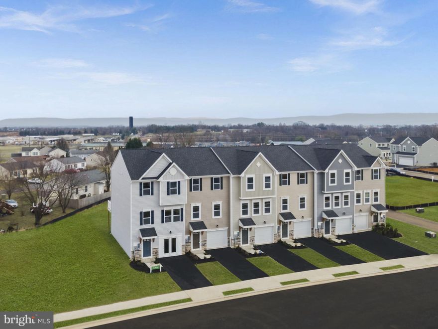 Luxury Townhomes in Huntwell West!

Welcome to the St. Paul! To be builtt!  Offering 1,989 square feet of living space.  This home features 3+ bedrooms, 2.5+ bathrooms, a spacious 1-car garage, and a large backyard. The main level boasts an open-concept design, where the generous family room flows into a modern kitchen with a pantry, breakfast nook, and kitchen island. Step outside onto optional composite deck—perfect for relaxing or entertaining.

Upstairs, the primary suite offers a luxurious retreat with a walk-in closet and en-suite bath. Two additional bedrooms, a second full bath, and a convenient laundry area complete the upper level. The finished basement adds extra flexibility, with the option to include an additional bedroom and bath.

Please note, the photos shown are of a similar home. This property is To-Be-Built. For more information or to schedule a tour, contact our Neighborhood Sales Representative. Visit us today at the model home located at 54 Sumter Ave, Ranson, WV