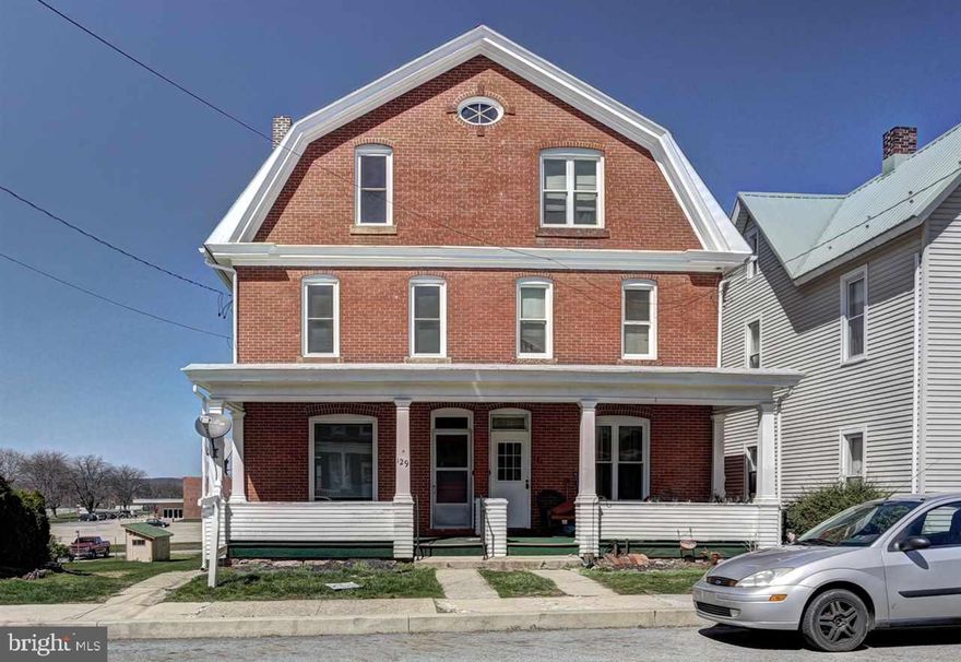 So much space in this duplex, you'll feel as if its single family living!  Solid, brick construction, beautifully restored original hardwoods and trims, with working pocket doors between LR and DR.  Kit was updated with island, and a finished attic to use as an additional 4th bedroom or bonus room- your choice.  Great price, location, and flow.  13 mo. HWA Home Warranty for peace of mind included with acceptable offer from seller.  Take a look today!