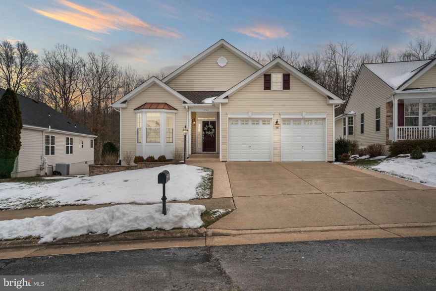 
﻿WELCOME TO YOUR DREAM HOME, DON’T MISS THIS ONE!!   Located in the prestigious Four Seasons 55+ neighborhood, this stunning Sanibel model, 4,700+ square feet, offers the perfect balance of convenience and luxury.  This home boasts formal living and dining rooms, complete with gleaming wood floors and crown molding and chair railing adding a touch of sophistication.  The bright and sunny kitchen offers ample storage with 42” cabinets, under cabinet lighting, plenty of counter space, stone backsplash, double pantry and eat in area.  Off the kitchen is an inviting family room featuring a stone front gas fireplace and serene views of the surrounding woods and common area, creating the ideal atmosphere for relaxation on those chilly nights.  Off the family room is a beautiful trek deck overlooking trees and common area.  The primary bedroom has a walk in closet, en-suite bath with two sinks, walk in glass shower and soaking tub.  Entertaining is a breeze with the large finished basement complete with a media room, office, bedroom and full bath, craft room, kitchen area plus a large storage room; beautiful stamped patio outside.  Added bonus, there is a storage room located above the extended 2 car garage.  Some updates include new roof Nov 2023; remote control blinds over soaking tub Oct 2023; humidifier Oct 2023; granite bath counters Jul 2023; stove and double oven Jan 2020; attic fan Sep 2019; water heater Jan 2018; primary bath glass shower doors Jun 2018; HVAC heat Dec 2013.  Awesome club house with
indoor and outdoor pools, tennis courts, fitness center, various exercise classes, nature trails, putting green, numerous clubs to join, social events.  Minutes to I95, Quantico, Historic Occoquan, Potomac Mills, close to shopping and restaurants.  Don’t miss out on the chance to embrace the retirement lifestyle you’ve always dreamed of.  SCHEDULE A SHOWING TODAY.  COME LIVE THE GOOD LIFE AT FOUR SEASONS!  WELCOME HOME!