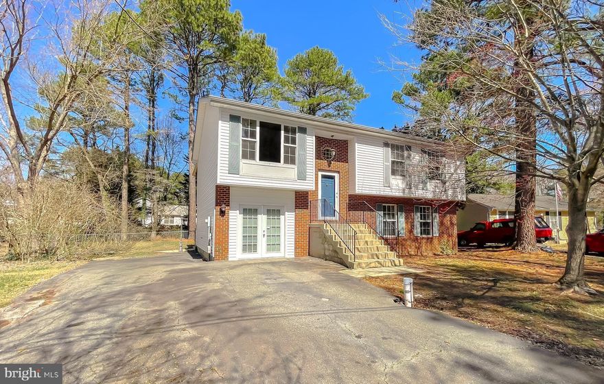 Welcome to this charming 5-bedroom, 3-bathroom home located in the desirable Drum Point community. This spacious home features gleaming hardwood floors at entrance, stairs, living room and hall. The main living area boasts vaulted ceilings, adding to the home's open and airy feel. The kitchen is open to the dining area, making it perfect for entertaining, and it leads out to a great screened-in back porch — perfect for crab feasts! The upper level includes 3 bedrooms and 2 full bathrooms, including an owners suite with private bath.  On the lower level, you'll find 2 additional bedrooms and another full bath, with one of the bedrooms offering a private entrance — perfect for guests or a home office. The large deck and fenced-in FLAT backyard are perfect for outdoor entertaining . The community offers exclusive beach access to the scenic Chesapeake Bay, providing you with a peaceful retreat just steps from home. Don't miss out on this incredible opportunity to own a beautiful home on a great lot with access to stunning community amenities.