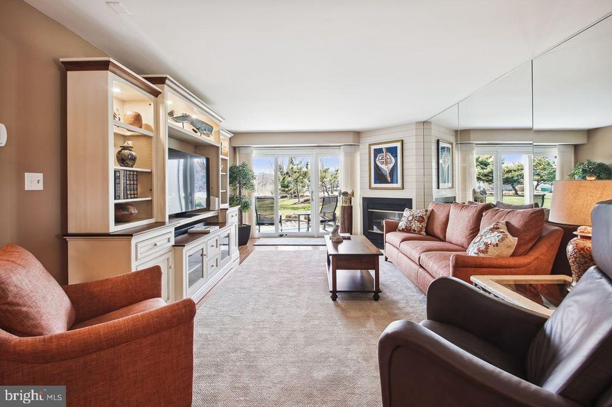 Not only is this a great location in Chesapeake Harbor with serene views of both the Chase Pond and the Chesapeake Bay, it has also undergone a pristine full interior renovation completed in the Fall of 2022. Enter to hardwood floors throughout, shiplap accents and an immediate water view through new Pella sliding glass doors. This kitchen is gorgeous. New tile floor, custom solid wood soft close cabinetry and finishes in a color scheme that takes you straight to the bay and the beach. Soft blue base cabinetry paired with white above, quartz countertops and a beautiful mosaic backsplash compliment new stainless steel appliances. The primary bedroom also features water views and sliding doors to the patio.  The renovated en-suite bathroom features wood base cabinetry, dual sinks and a fully tiled walk-in shower. The primary bedroom has a walk-in closet with a california closet organization system. A new LG slimline stackable washer/dryer are located in the unit, as well as both a new HVAC system and new water heater.
Make your way out to the patio to enjoy the expansive grounds of Chesapeake Harbour and community amenities. The community beach with small craft storage and the community pool are both just steps from your back patio. Paths surround the community for an easy stroll to tennis courts and the community marina featuring the new Beacon Restaurant and Bar, a favorite outdoor gathering spot with great summer entertainment. There is nothing needed in this beautifully renovated condominium, just move in and enjoy all the amenities this community has to offer.