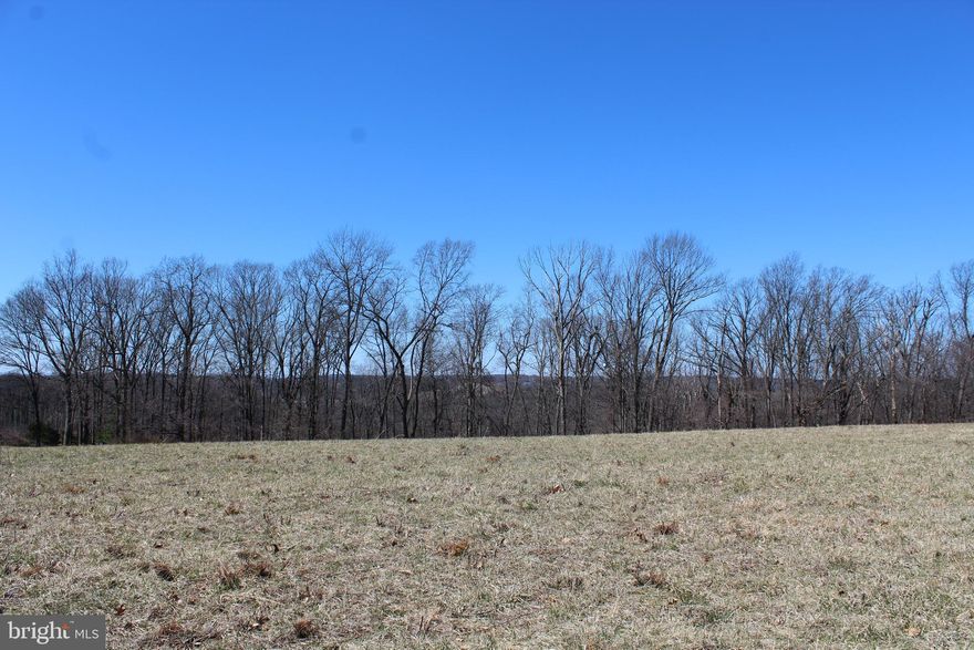 No Builder tie-in.  Use your own builder. This 2.47-acre lot in the picturesque Carroll County/Manchester area offers a peaceful retreat surrounded by natural beauty. The land is spacious and offers plenty of room for various outdoor activities, with ample space for a home, garden, or additional structures. A well is already on-site, making it an ideal location for someone looking to build or establish a self-sufficient property. The landscape is level to rolling  and open areas that capture the essence of country living. Whether you're looking for a quiet getaway or a place to build your dream home, this lot provides the perfect blend of tranquility and convenience. Carroll County's charm and community spirit, combined with this expansive lot, make it an exceptional opportunity for buyers seeking a serene lifestyle.  This lot is newly recorded in Manchester known as the "Huber Property".  Beautiful 2.47 acre clear lot with included well.  Well depth is 500' @ 2.5 GPM.  Perc approved for a 3 bedroom sand mound septic system. No covenants, restrictions or HOA.  Lot is ready for a building permit application and is perfect for a Rancher or Colonial style home.