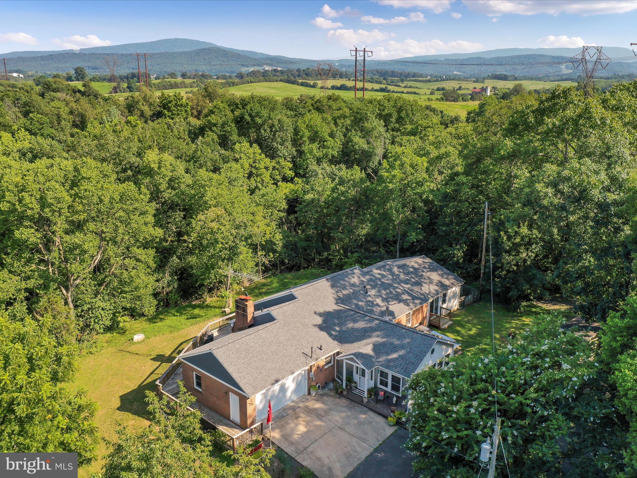1857 Mary’s Shady Lane | 5 Acres of Freedom | Homesteader’s Haven Minutes from Town
If you’ve been dreaming of chickens in the yard, veggies in the garden, and a life rooted in fresh air and freedom—this is the place. Welcome to 1857 Mary’s Shady Lane, where the homestead lifestyle begins without giving up convenience.
Set on 5 beautiful acres just two minutes from the heart of Front Royal (and without a single winding mountain road!), this property gives you space to grow—literally and figuratively. Raise animals, plant fruit trees, have that greenhouse or barn you’ve been dreaming about for years. The land is level, open, and full of potential.
Inside, the home offers 3 bedrooms and 2 full baths all on the main level, including a cozy sunken living room and two versatile bonus rooms—perfect for a playroom, hobby space, or home office. The full basement has already been framed, just waiting for your finishing touches.
With the Shenandoah River nearby and the Blue Ridge Mountains as your weekend playground, this is more than a home—it’s a lifestyle. Morning coffee on the porch, fresh eggs from the coop, starlit nights by a fire pit... it’s all possible here.
Bring your dreams and let them take root. This is the homestead you’ve been waiting for.