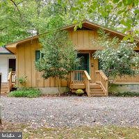 Make this 1300 plus home a fun place to live. Finish the side porch for crabs eating. Enjoy the owl who lives in the tree behind the house. Access basement from the inside and the outside. Wrap deck for viewing nature. Update bathrooms. Create the kitchen of your dreams. Feel the warmth of the gas fireplace, all on one floor. Living Room carpets being replaced and basement is being freshened up by Home Services. Paint the Living Room paneling to lighten up the room among the trees. This home is perfect for any size family, whether just starting out or retiring. Loads of potential!!!