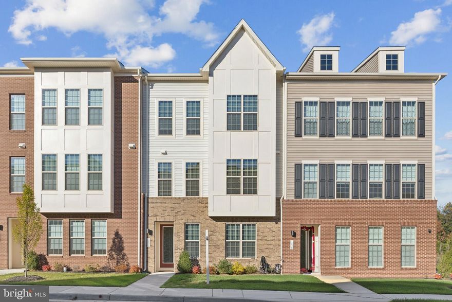 Two years young  & close to the charm of downtown Leesburg this is the perfect home for you! This Holden model built by Dream Finders in 2023 offers 2,734 square feet, a two car garage, 4 bedrooms and 3.5 bathrooms.  The home sits East facing and has lots of natural light.  9' ceilings throughout. The expansive living level has a chef's kitchen with quartz counters, large island, stainless steel sink/appliances, gas cooktop with stainless hood and wall oven. There is an abundance of kitchen storage with the upgraded cabinets and double pantry. Enjoy entertaining in the living and dining room areas with electric stand alone fireplace. Luxury vinyl plank floors throughout the main level provide a modern yet cozy atmosphere. The living area leads to a large covered balcony/lanai - perfect to relax. Upstairs there are three spacious bedrooms and 2 full bathrooms. The primary suite has an oversized walk-in closet, ceiling fan and luxury primary bathroom with walk-in shower, dual vanity with granite countertops and a water closet. The two oversized secondary bedrooms include blinds and ceiling fans. The secondary hall bathroom has double sinks and a tub/shower combo. Upper level laundry room - washer/dryer will convey.  The lower entry level of the home has a 4th bedroom and third full bathroom - perfect for a home office or flexible guest space! The home offers a private driveway where you can park 2 cars as well as the 2 car garage that has epoxied floors and 50 amp rapid car charging station. There is ample parallel street parking for guests. Short drive to the wineries, farms and breweries of Western Loudoun! Walk to shopping and close to schools.  Additional conveyance items that will convey as-is include: alarm system, electronic doorbell, stand alone electric fireplace, garage freezer, garage shelves & the 4 wall mounted TVs.